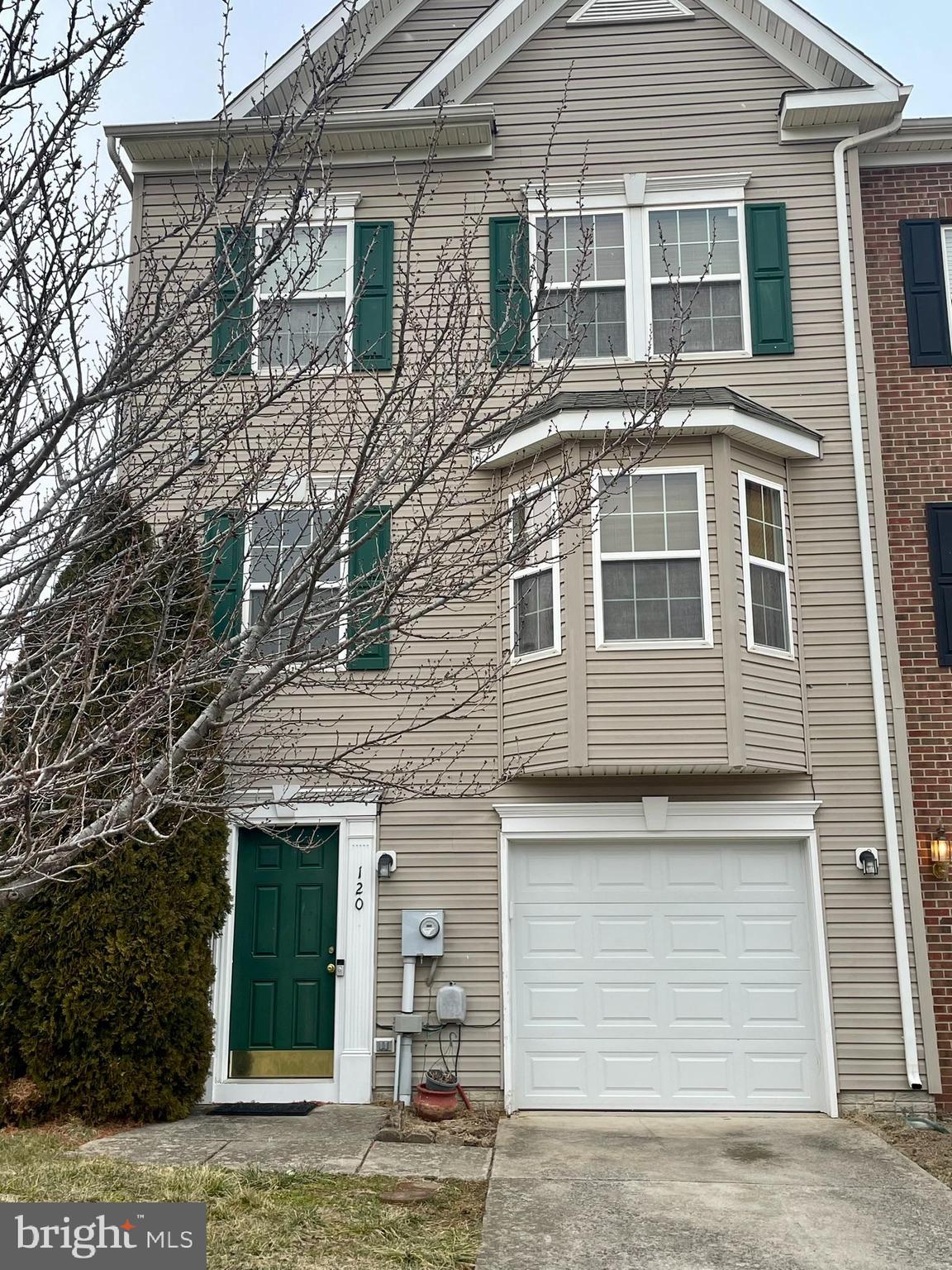 Gorgeous 3/3.5 bath end-unit townhouse with bump-outs on all levels on the outskirts of Martinsburg!! A spacious foyer greets you as you enter with a coat closet, entrance to the garage, and door leading to the voluminous rec room with a full modern bathroom and walk-out to the fenced-in backyard! Luxury laminate flooring on the entire lower level! The main level showcases an eat-in kitchen with vinyl flooring, a large center island, pantry, and top-of-the-line appliances. Nice sunroom off the kitchen with a walk-out to the deck giving you a magnificent view of the countryside. Just adjacent to the kitchen is the combination dining/living room with gleaming hardwoods, a powder room, and a large bay window letting in an abundance of natural light! Upper level with unusually large primary with a walk-in closet, cathedral ceilings, and ensuite bathroom with laminate floors, dual sink vanity, soaking tub, and shower stall with tiled walls. Two other spacious bedrooms on the upper level with cathedral ceilings, ample closet space both sharing a full modern hallway bathroom. Upper-level laundry room! New HVAC in 2021!! Shops, restaurants, and I-81 close by!!