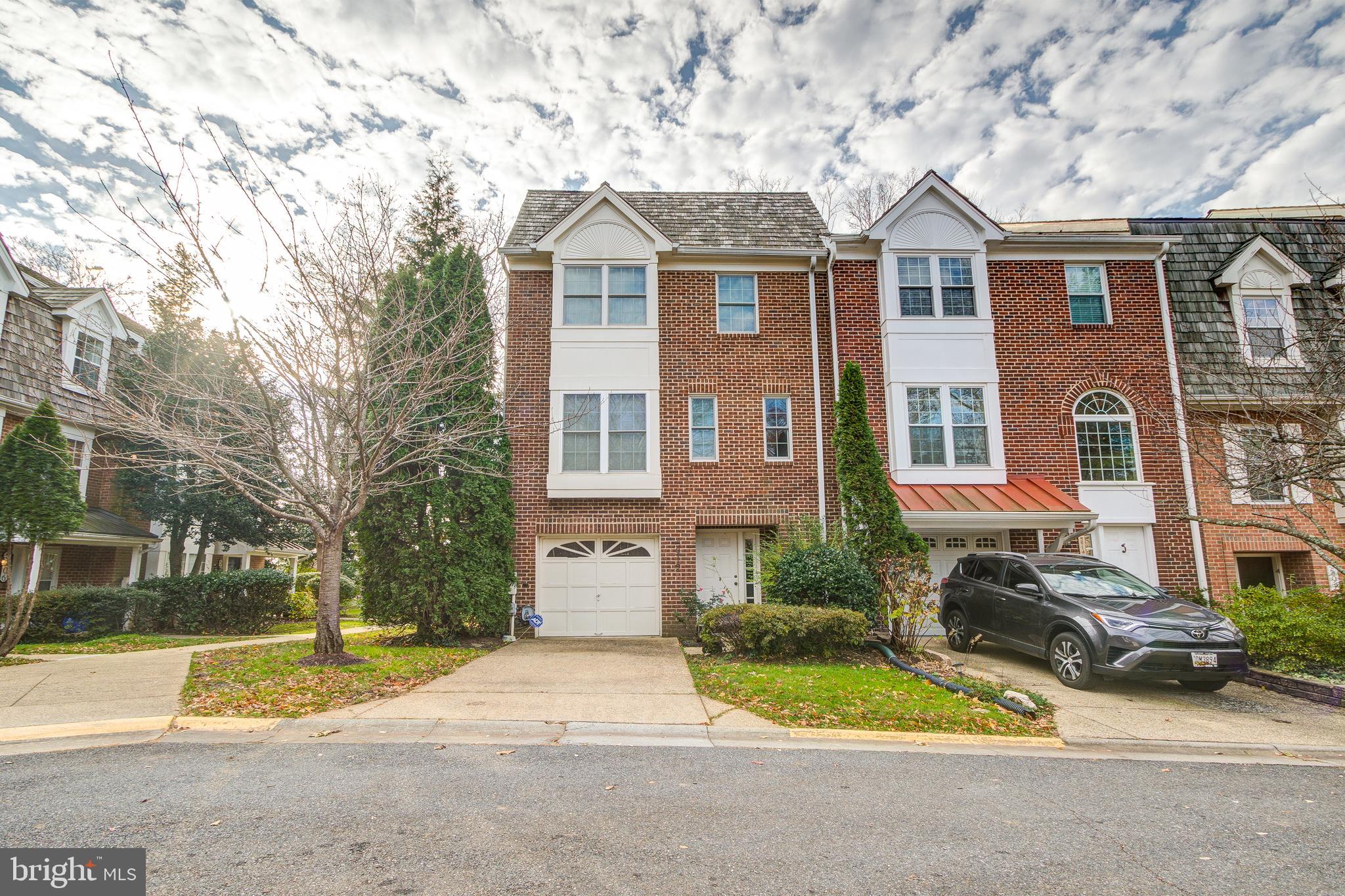 This property is ready for you to call it home! This beautiful end-unit all brick townhome features 3 bedrooms with 2 full and 2 half baths including a garage. The main level is bright and spacious with hardwood flooring throughout and custom millwork details. The kitchen is upgraded with stainless steel appliances, granite counters, and ample storage space. The formal dining room is large and opens up to the living room with two story ceilings and a floor to ceiling stone fireplace. The living room flows nicely out to the back deck with peaceful views of the trees. The upper level of this home features 2 spacious bedrooms and a full bathroom. The top level is your master bedroom retreat with vaulted ceilings and a cozy fireplace. The master bedroom ensuite features a walk-in closet with custom organization system and a huge walk-in glass and tile shower. The lower level is fully finished with a walk-out to your patio and yard. You also have a half bath, another fireplace, and a built in wet bar. Ideally located within minutes to major commuter routes and public transit. Less than a mile to White Flint Metro! Close to shopping, restaurants, and entertainment venues at Pike & Rose and Downtown Bethesda.