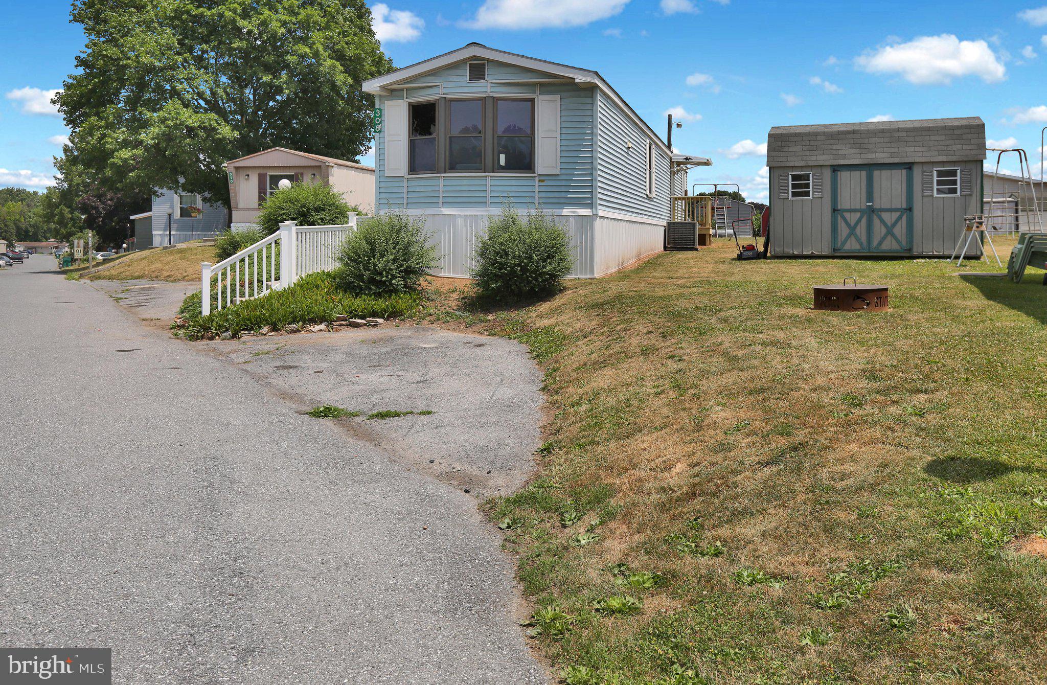 Discover the charm of this beautifully remodeled 2-bedroom, 1-bathroom manufactured home in the welcoming Palm City Park community. With a major renovation completed in 2026, this home features modern luxury vinyl plank flooring and cozy carpet, creating a warm and inviting atmosphere. The efficient kitchen is equipped with essential electric appliances, including an oven/range and refrigerator, perfect for culinary adventures and features brand new quartz counter tops with a breakfast bar.  Enjoy the convenience of main-floor laundry and a completely remodeled bathroom with a stall shower. The single-wide layout maximizes space, offering a comfortable living experience. A prime lot in the park as it backs up to the playground.   Brand new skirting and front porch.