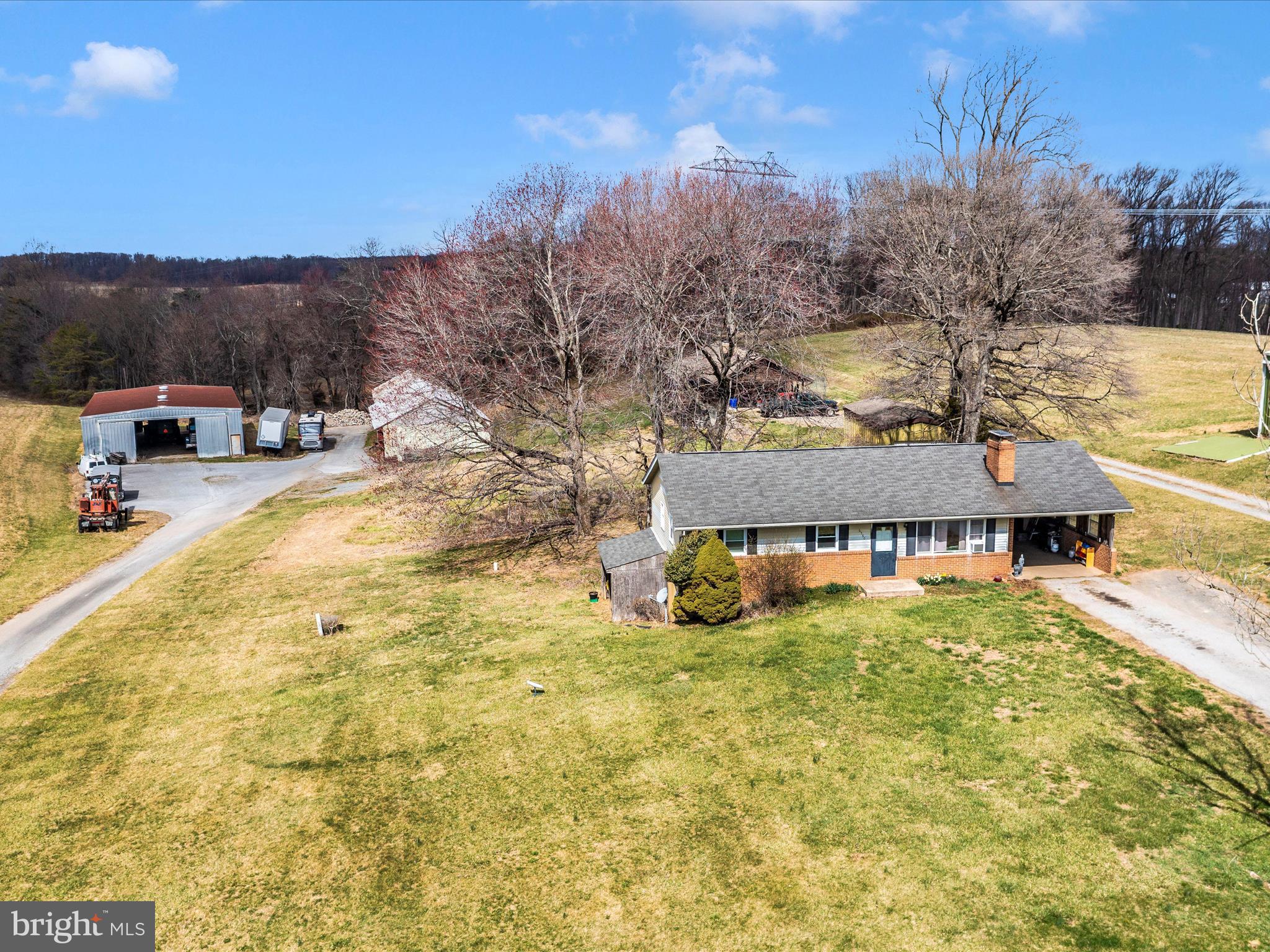 Nestled in the heart of rural Southern Carroll County,  this 18+ acre property offers a rare blend of tranquility, opportunity, and convenience. Surrounded by scenic unencumbered acreage, the property features 3 dwellings and multiple large outbuildings  providing boundless potential for income or multi-generational living.   The homes are modest in style and condition but offer the perfect canvas for customization and opportunity.   
This property is a haven for those with agricultural aspirations. Whether you're envisioning a thriving crop farm, an equestrian facility for personal  or business,   a family 4-H/ private homestead  or simply a   peaceful country retreat,  the possibilities here are as vast as the land itself. The outbuildings add to the versatility, ideal for storage, workshops, or expanding your farming operations.
Beyond the property's serene rural setting, it benefits from proximity to nearby conveniences. You can enjoy the peacefulness of country living without sacrificing easy access to shopping, dining, and essential amenities.     This rare to the market property is a retreat from the hustle and bustle of modern life.
For those with a vision and a dream, this property offers endless possibilities. Whether you're an aspiring farmer, an investor seeking income potential, or someone who simply desires a slice of paradise in Maryland's countryside, this special 18 acre property is waiting to be the backdrop of your next chapter.  

Seller is in process of having a boundary survey completed to confirm property lines and inclusion of the small farmhouse fronting Gillis Falls Road. 

Existing tenants interested in continuing their month to month leases.   Please DO NOT enter property without an appointment.