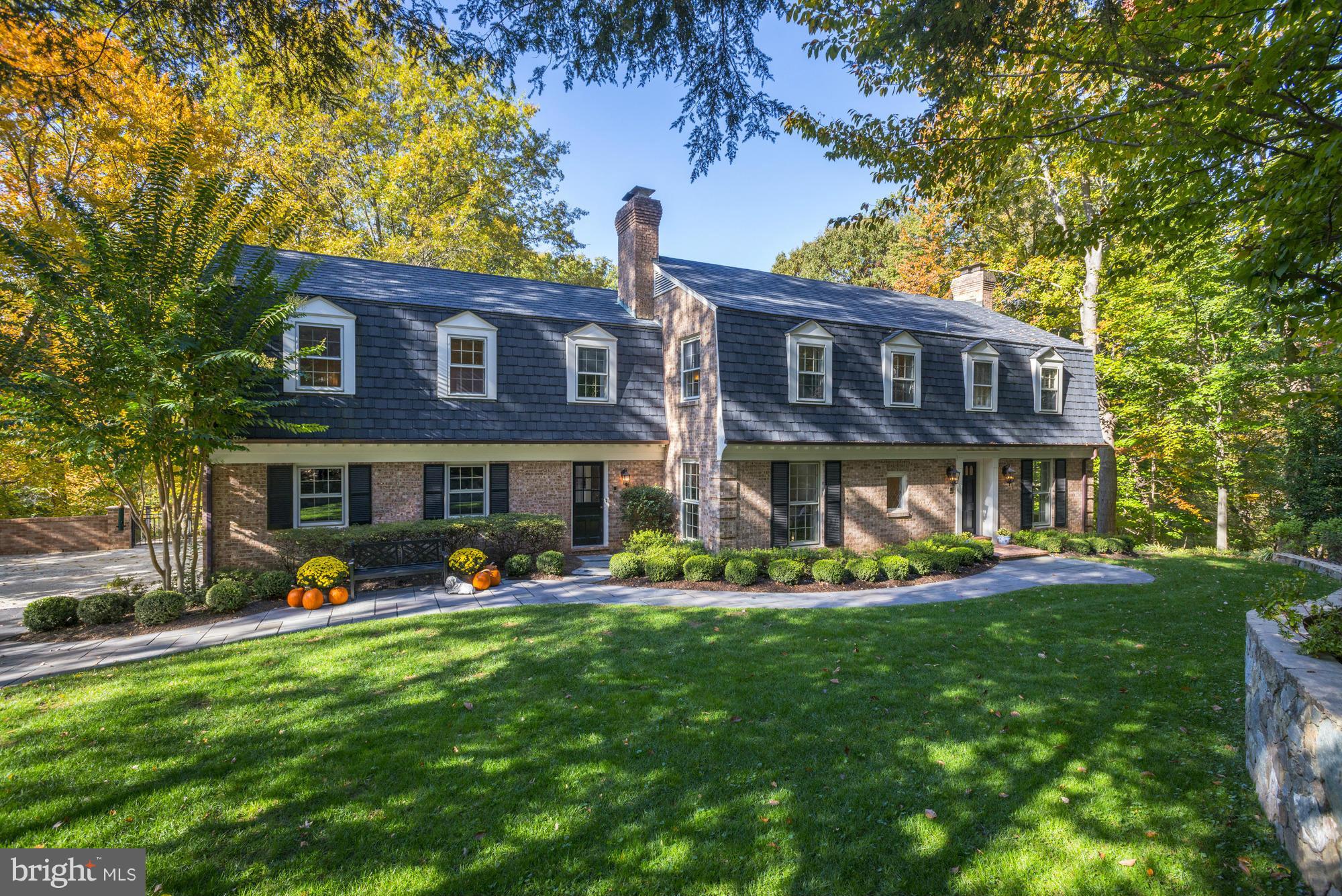 Charming sun drenched brick colonial on spectacular 1.2 acre lot.  Expansive private backyard with mature trees. Beautifully remodeled kitchen. Spacious master suite with sitting room and large walk-in closet. Walkout lower level with au pair suite. Sited on a cul-de-sac just minutes to I-495. Surrounded by multi-million dollar homes.