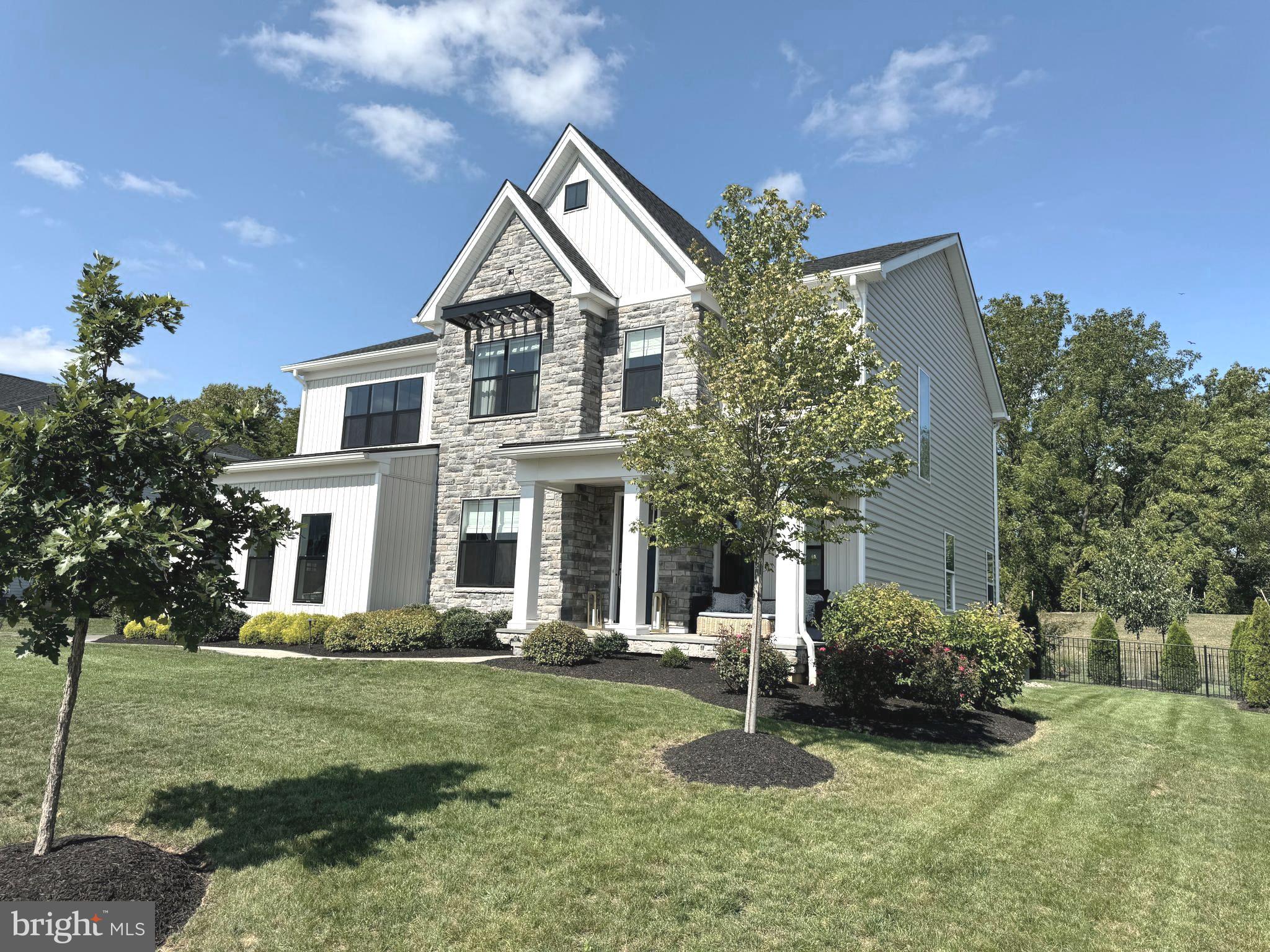 Better than new, this 2-year young beautifully upgraded home with every bell and whistle imaginable is on the market in the desirable Reserve at Center Square community in the Methacton School District – and it’s ready for a quick delivery!! This home has $345,000 in builder upgrades and another $200,000+ in upgrades by the current owner – it truly shows like a model! To build this model with Toll Bros today, your starting price would be $1,385,000 without any of these upgrades!! See upgrade list in the documents section. With the open floor plan, this home is where modern elegance meets practical design. Highlights include the beautifully Finished Basement that includes an in-law suite with sitting area and decorative barn doors and a large rec room; Beautiful millwork including decorative moldings, accent walls, and beams added to the ceiling; Wood floors on 1st and 2nd floors; 10’ ceilings on main floor and 9’ ceilings on 2nd floor and lower level; Customs closets; Custom shades; Upgraded, top of the line light fixtures from Serena and Lily and Ro Cham Beaux; Serena and Lily mirrors in most baths; AND the home is in one of the best locations in the community backing to community open space for great privacy. Outside you will find a back yard oasis full of upgrades that includes a custom pavilion with electric and TV mount, a huge custom patio with built-in BBQ, custom walkways, a hot tub, a play area with rubber chips (playset included), extensive landscaping, decorative black metal fence and sprinkler system; Upon entering the house from the welcoming front porch, you immediately see how special it is with the wide-open floor plan, gorgeous flooring, and beautiful millwork. The Dining room with gorgeous millwork is completely open to the entry hall, Kitchen, breakfast room and family room. The custom kitchen features top of the line Century cabinets, quartz countertops with an elegant waterfall edge, top of the like stainless appliances including Wolf gas range, under cabinet and toe kick lighting, and an expansive breakfast bar that seats 6 with storage below! Off the kitchen in the back of the home is the bright and sunny breakfast room with 3 walls of windows and a door to the back yard. There is a study/office nicely tucked away for convenient working from home! The family room is completely open to the kitchen with a gas fireplace, and tucked away just off the family room is a bonus room perfect for play room or home office.  Off the kitchen is a mudroom with a huge, custom pantry closet, and there is a charming powder room with designer wallpaper and a walk-in coat closet off the entry hall.  Upstairs you will find a large, versatile loft area with wood floor and numerous windows, two bedrooms that share a Jack and Jill bath (double sink, and separate shower and lav area); a bedroom suite with private bath and custom walk-in closet; a convenient laundry room with an abundance of cabinetry; and the gorgeous primary suite with an expansive custom closet and luxurious bath with two custom vanities, and an oversized, beautifully tiled shower with multiple shower heads. The lower level features an expansive, carpeted rec room, plus a bedroom suite – perfect for in-laws, nanny, or adult children with the private bath, sitting area, and walk in closet! The charming barn doors add beautiful detail to this versatile space. This vibrant community at the Reserve is welcoming to newcomers with plenty of opportunities to meet your neighbors at the monthly block parties, chili cook-offs and holiday celebrations. This convenient location is just minutes from downtown Skippack, and just a short distance to Blue Bell, Lansdale, Plymouth Meeting with a tons of shops and restaurants.  There is also great access to 202, 476, and the 276 Turnpike that makes your commute to work a breeze.