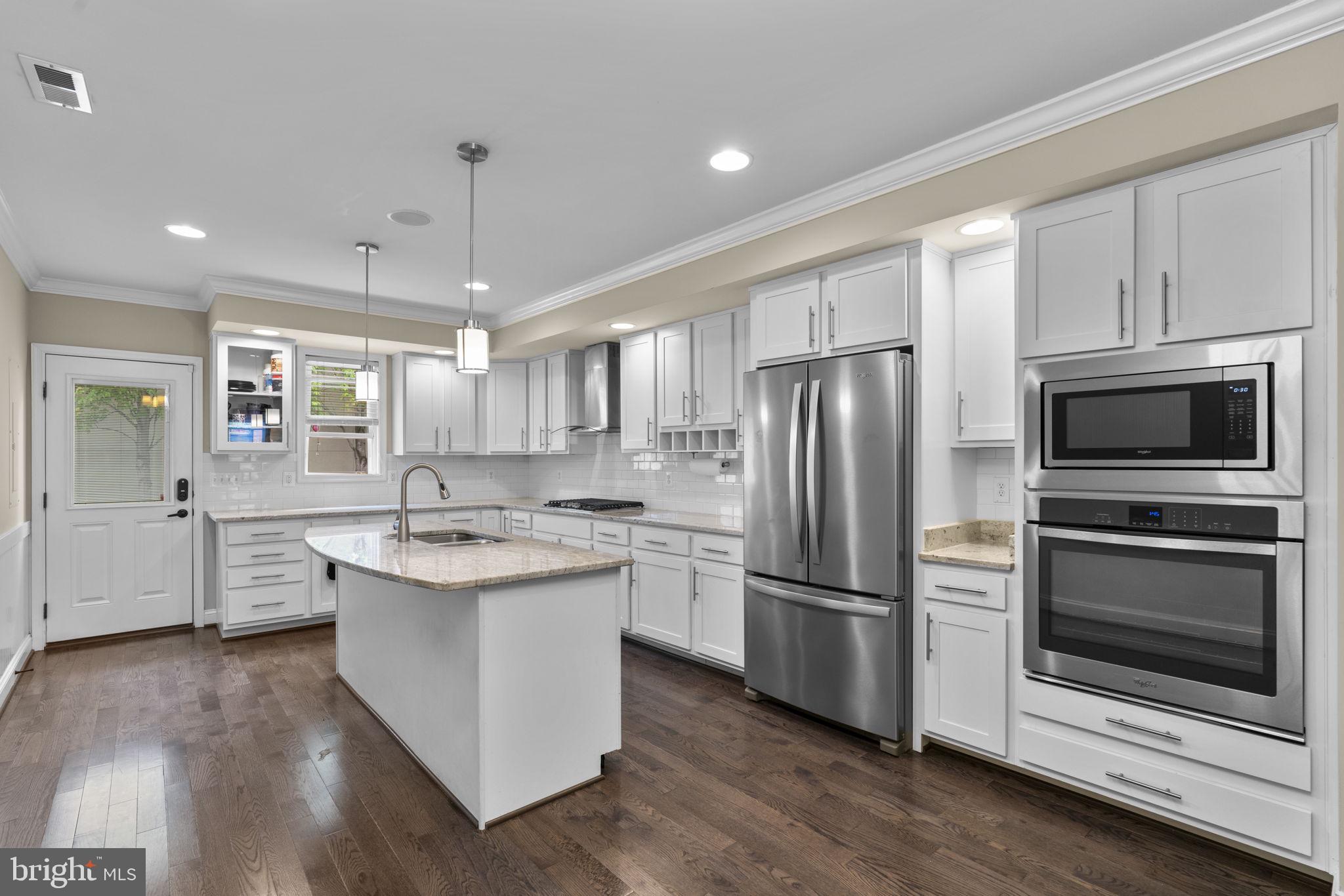 Location, style, and functionality collide to be the perfect house at 3127 Elliott St. Nestled on a tree lined street with plenty of parking in the heart of Canton awaits your dream home! Stepping inside you're immediately wowed by the iconic Baltimore brick wall and the impressive coffered ceiling. The warm and inviting living room, with stunning hardwood floors, is ready for all your entertainment needs and leads back through the dining area to the expansive and updated kitchen. Gorgeous white shaker cabinets and stainless steel appliances make this a stand out dream kitchen perfect for every chef's needs. A handy half bathroom makes this this level have everything you need. Out the back door is a patio ready for entertaining or outdoor storage. The entire house has a built in speaker system as well! The upper level features two enormous bedrooms and bathrooms. The owner's suite is designed for luxury with an en-suite bathroom complete with oversized shower with dual shower heads, a double vanity, a walk in closet, and plenty of space for any size bed you'd like to have in there. The second bedroom is generously sized, features the iconic brick wall, and is right next door to another fully updated bathroom. To keep your life easy, laundry is also located outside the bedrooms. The freshly stained (2026) rooftop deck is a stunning addition to this home. Perfectly suited for entertaining, grilling in the summer evening hours, taking in the views, or just a simple morning coffee. Catch the 4th of July and New Years Eve fireworks from your own rooftop! The lower level is a flex space equipped with a fully updated bathroom with a walk in shower. You can use it as a bedroom with en-suite, an office, a living room, a play room, a music room, or anything else you can imagine. The entire house has been painted top to bottom to make it ready for the next lucky owner! This is an idyllic home in an incredible area of Canton. Just a few blocks from the waterfront park, you can have waterfront views anytime you like. Around the corner you have iconic places like Mamas on the Half-Shell and Cafe Dear Leon, in addition to an endless number of other restaurants and coffee shops to visit. Within a few minutes you have several community sports leagues that meet nearby, including pickleball! 3127 is perfectly situated to be a private retreat in a bustling community. Come fall in love today!