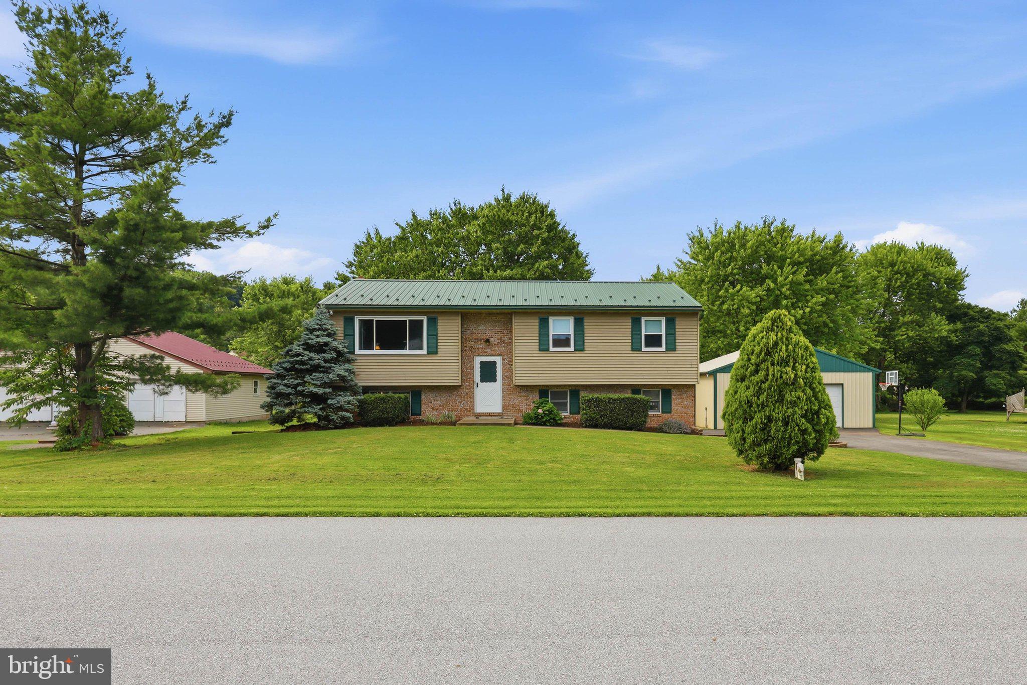 Welcome home to this charming bi-level nestled on a generous .70-acre lot in a quiet country cul-de-sac, where the backyard backs right up to a scenic creek, your own private slice of Lancaster County paradise.
For the hobbyist, the mechanic, or anyone with serious toys to store, the showstopper here is the massive 30x30 detached garage featuring an 8-foot x 18-foot overhead door. More than enough room for a full workshop, RVs, boats, equipment, or all of the above. Whether you're a weekend warrior or a seasoned craftsman, this space truly delivers.
The main level offers comfortable everyday living with a large eat-in kitchen featuring laminate floors, a bright living room, three bedrooms, and convenient main-level laundry. Lower level includes a large cozy family room, 1/2 bath & walkout to the concrete patio.
When the weather's right, take the party outside. A composite wood deck and concrete patio below give you multiple levels of outdoor entertaining space, all framed by towering shade trees and the peaceful sounds of the creek beyond. New windows throughout the home bring in natural light and add lasting efficiency.
And the location? You couldn't ask for better. You're right in the heart of some of the best Pennsylvania Dutch Country has to offer, minutes from the charming shops and restaurants of Kitchen Kettle Village, the Green Dragon Farmers Market in Ephrata, the world-famous Sight & Sound Theatres, Lapp Valley Farm's legendary homemade ice cream, and the historic Strasburg Railroad. Outdoor lovers will enjoy easy access to Lancaster County's covered bridge tours, miles of hiking and biking trails, and hot air balloon rides over the rolling Amish farmland. Downtown Lancaster's acclaimed dining, arts, and entertainment scene is just a short drive away.
Space, serenity, and an unbeatable Lancaster County address. This one has it all. Schedule your showing today!