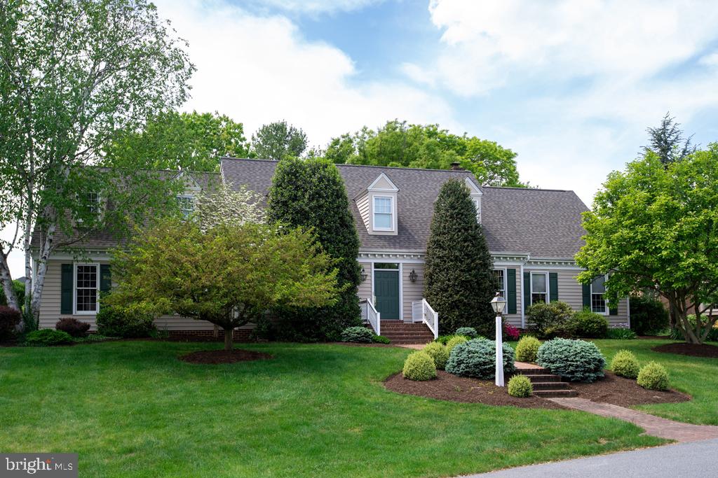 Beautiful Cape Cod style home in the very desirable neighborhood of Waterford Estates.  This 3,000+ square foot home   is in excellent condition with many desirable features.   1st floor features an open kitchen, breakfast area and family room.  The family room has an 18 foot cathedral ceiling with a loft overlooking and a fireplace with built in cabinetry and shelving.  The kitchen has been updated with granite counter tops, island with electric range and built in oven and microwave.  The house also features a 1st floor master bedroom with large bath and walk in closet.  Additionally, the 1st floor features a formal living room or sitting room that can be open to the family room and a formal dining room.  The oversized laundry and 1/2 bath are also on the 1st floor.  The 2nd floor features a loft area with built in desk and bookshelves and window seat.  Also an oversized garage & large unfinished basement.