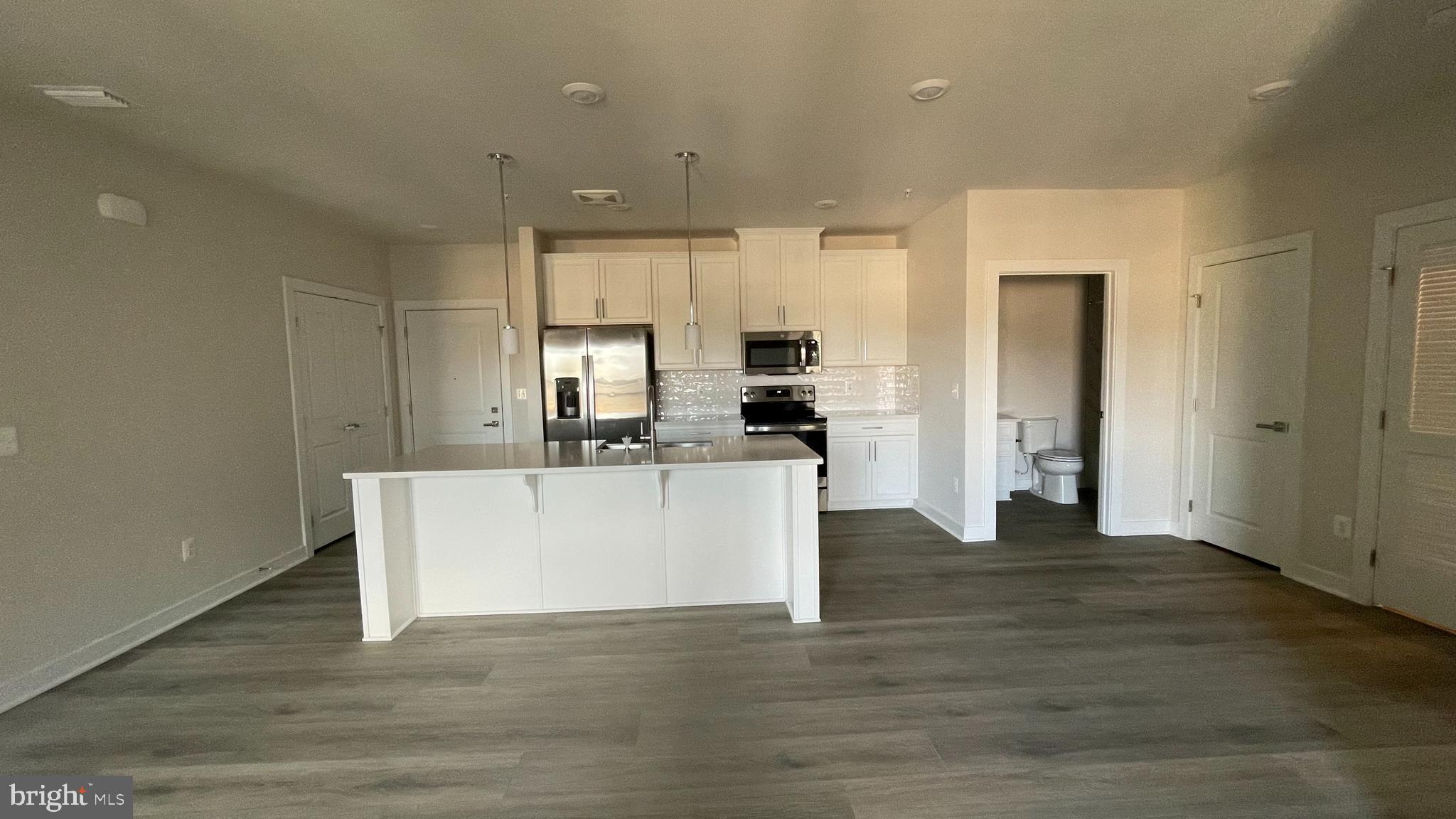 Enjoy almost new condo, Near Metro, 2 Bedroom, 2 Bath, Simply Beautiful. You will love the kitchen, Huge Island, Stainless Steel Appliances, with Wood flooring, Washer Dryer inside condo. Lots of tech amenities, Location and walkability to shopping/dining/metro. Metro is less than .35 miles (10 min walk) and grocery/food/etc is a 5 min walk, just around the corner. Unit M is on the 3rd floor, Building has elevator, grilling picnic facilities, see attached document.