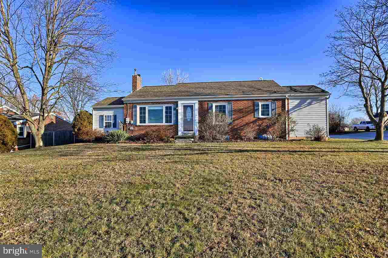 Large 3 BR/ 2 bath brick ranch w/pole building. Huge living room w/newly finished hardwood flrs & Quadra-fire pellet stove w/brick hearth.  Roomy kitchen w/stainless appliances. Mud room addition w/knotty pine walls & ceiling & walk-in pantry.  Replacement windows. New electric service. Updated heat & air. Fenced yard. Great corner location near fire co. & park.   24 x 40 pole building w/ 10 ft. ceilings, 16' x 9' & 8'x 9' garage doors.