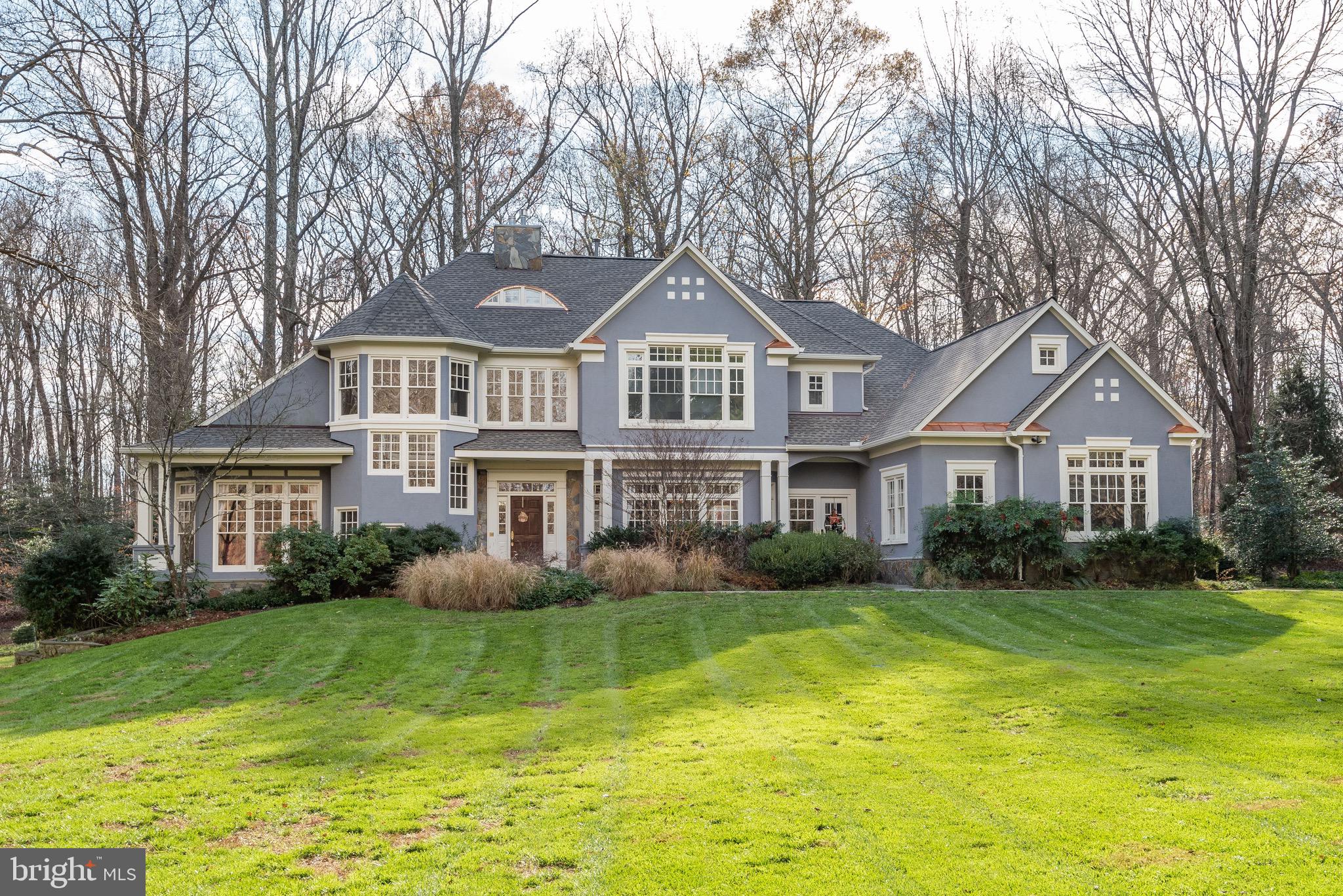 PRICE REDUCED!  Welcome to 7100 Saunders Court, an impressive Nantucket style stucco and stone home sited on one of the most incredible lots in all of Bethesda. This almost 3-acre flat, south-west facing private lot backs to Parkland and realizes some of the most spectacular sunsets imaginable.  Originally built by Ted Visnic in 1998, this home has been beautifully and tastefully renovated by the current owners where no detail was overlooked.  Some of the notable improvements are:  stunning chefs kitchen with commercial grade appliances and Calcatta Gold marble; sumptuous primary suite with exquisite marble bath and fantastic closets; gorgeous secondary baths; new roof with copper flashing and new gutters; freshly painted inside and out and beautifully refinished hardwood floors.  One of the special features of this house is the main floor bedroom with ensuite bathroom and multiple places to study and work.   The lower level features a large recreation room, bedroom and full bathroom, gym, sauna and second full bathroom and loads of storage.  Located just minutes from downtown Bethesda, the Beltway, great restaurants and shopping, (not to mention award-winning schools), you will be hard-pressed to find a home of this size and quality that compares.  Must see to believe.  Even the most discerning upper-bracket buyer will be impressed. Whitman school district.
