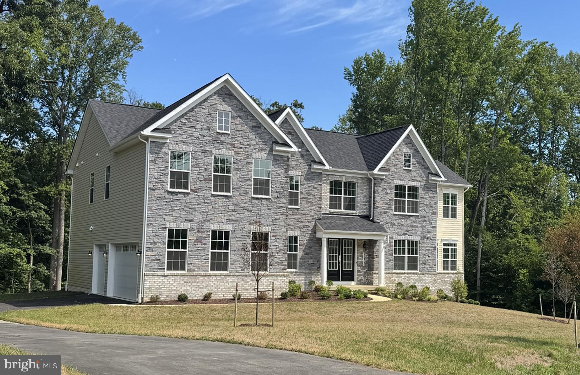 Up to $15,000 Towards Closing Costs!* This grand Kingsport II floorplan is your last chance to live in Caruso Homes'  Bennington Farms community! This particular homesite backs to serene trees, providing a private backdrop to enjoy your home. This home features a three car side load garage and stunning stone elevation. Step inside to be greet by an open-concept floorplan, complimented by a formal dining room and living room. The great room features a coffered ceiling and electric fireplace, and the extended morning room addition provides additional natural light.

At the heart of the home, the deluxe gourmet kitchen impresses with stainless steel appliances, a farmhouse sink, and a butler's pantry. A first-level in-law suite with full bath offers flexible living for multi-generational households or guests. Oak main and rear staircases lead to the upper level, where the primary suite awaits with a tray ceiling, spacious sitting room, dual walk-in closets, and a luxurious en-suite California bath.

The fully finished basement expands the home's living space with 9-foot ceilings, recreation room, and a double areaway. With premium upgrades throughout, this exceptional Kingsport II home delivers the space, style, and sophistication, perfect for the modern lifestyle.

Experience tranquility and luxury at Bennington Farms—an estate community with no HOA restrictions. Surrounded by lush greenery and serene views, enjoy privacy and space perfect for outdoor living. Don’t miss your chance to own a unique piece of luxury in this one-of-a-kind setting. For more information about this home, contact Caruso Homes today. *Offer valid on NEW contracts only. Some restrictions may apply. Must use preferred lender and title company.