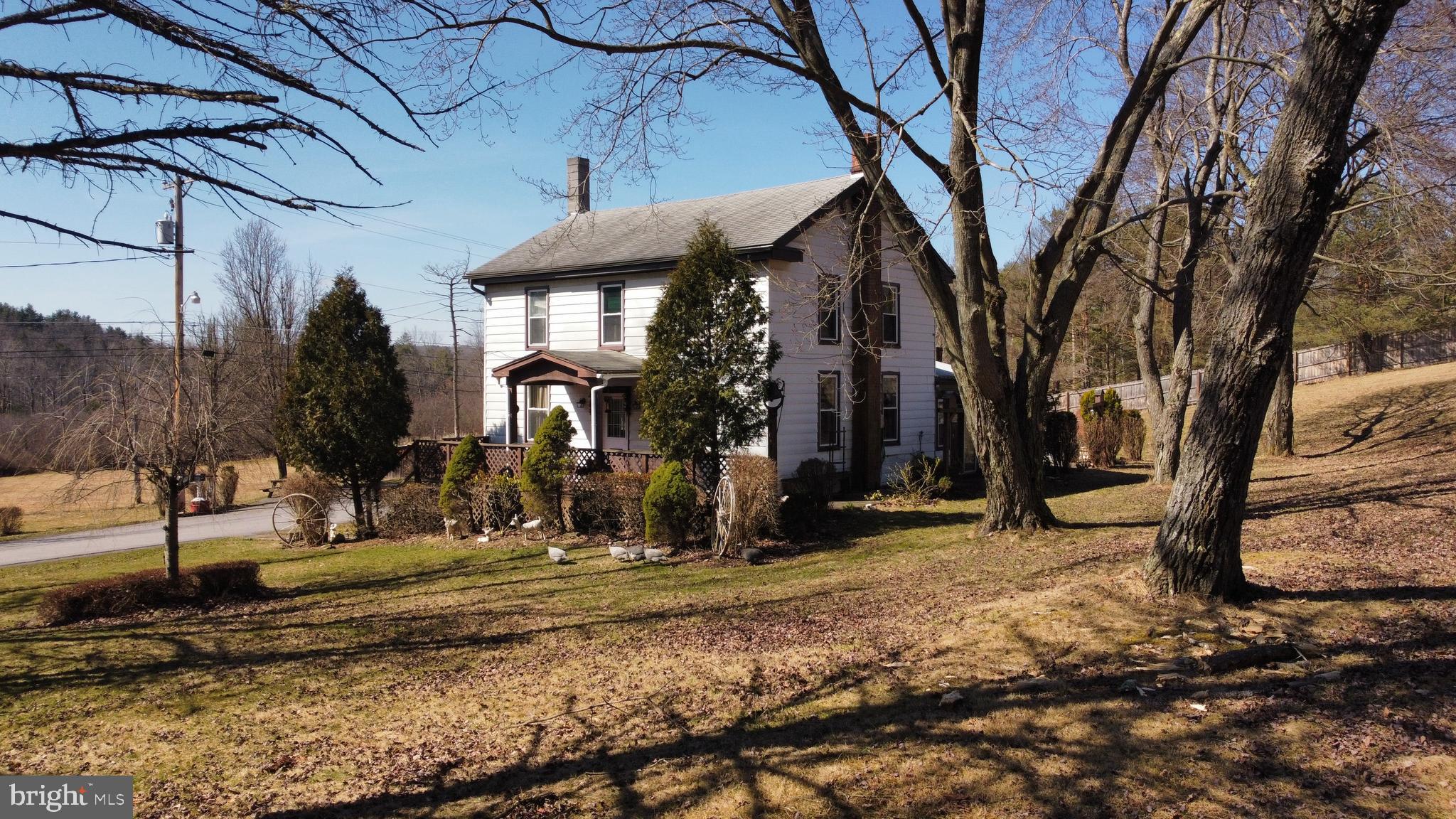 Awaiting just outside the heart of Philipsburg sits this 4 bedroom 2 bath home on over 5 acres. The first floor features a large eat-in kitchen, off of the kitchen is a sunroom with laundry hookups, a living room spacious enough for the whole family, as well as the master bedroom, and a bathroom. On the second floor there are 3 additional bedrooms and one large bathroom. A smaller room on the second floor is the perfect sized room for an office or craft space. Access the basement from one of two staircases inside the home or from the walkout inside the carport. In the basement is a supplemental coal and wood burning heat source.  In addition to the carport, there is a two car detached garage.