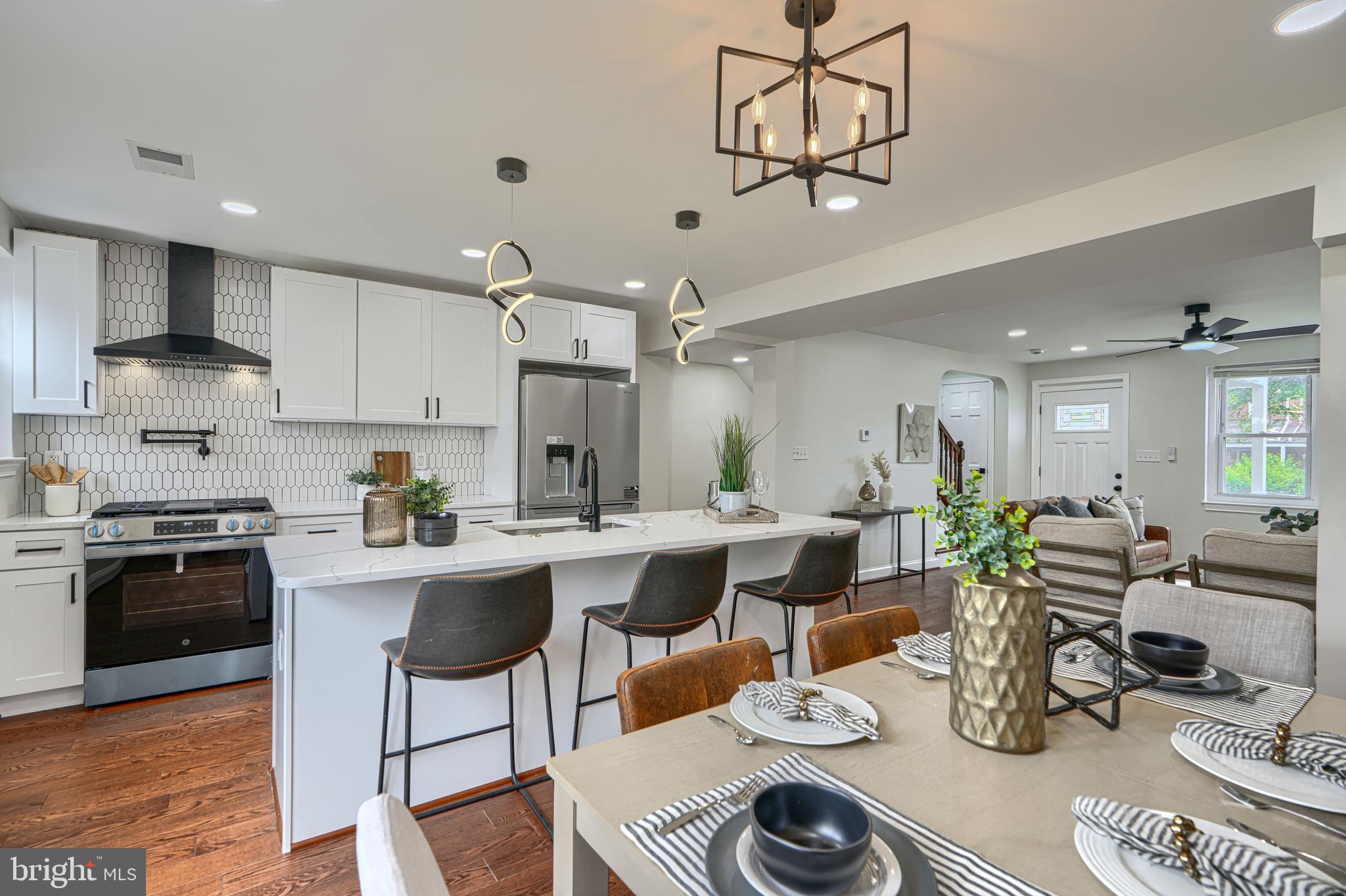 An ode to Towson: The opportunity has arrived to own an unmatched home, crafted with love, and planted in a neighborhood with deep history. Welcome to a renewed residence with detailed beauty and a worry free lifestyle. 
The real hardwood floors cover the entire main floor and second level. The newly installed architectural shingle roof, HVAC system, and air ducts all consider health conscious and allergy sensitive individuals as well as long term sustainability. 
The kitchen awakens your culinary desires with matte black accents, a four part french door refrigerator, a large seven foot long island, a backless range, coordinated with a range hood and pot filler to match. There is a special appliance cabinet in the island to fit your air fryer, microwave, or other appliances that would normally take up counter space.
Three spacious bedrooms await you upstairs along with a custom designed full bathroom with subway and chevron tiles with matte black accents and white hexagon tiles to complement the floors. A waterfall shower head along with a separate handheld shower head complete your bath experience. 
The spacious basement includes an additional living space as well as another full bathroom with matching details. The laundry area with a new washer and dryer is included. The basement has been waterproofed and includes a sump pump. 
Located in a highly rated school district and walking distance to Whole Foods Market, Towson University, Downtown Towson, as well as parks and many other attractions, the peaceful neighborhood of Towson Manor Village exceeds expectations.
This home was made to be cherished and appreciated. Welcome home!
