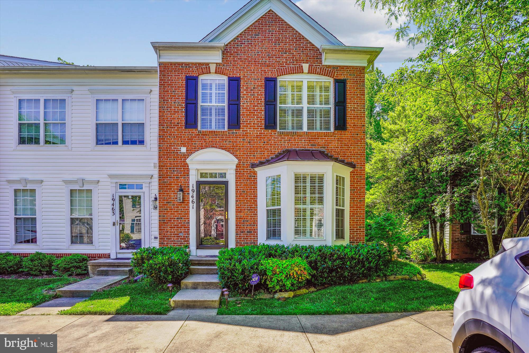 Light filled, brick front, 4 bedroom, 3.5 bath, end unit townhome.. Main level features hardwood floors, plantation shutters, gourmet kitchen with pantry and table space.  Large deck off of the kitchen that overlooks the woods.  The upper level features a primary suite with a large walk in closet, soaking tub, large vanity with two sinks and two spacious bedrooms with a full bath.  The walk out level basement is fully finished with a bedroom, full bath, den/office and a family room with a frieplace.  Walk out from the family room onto the flagstone patio that faces the woods.