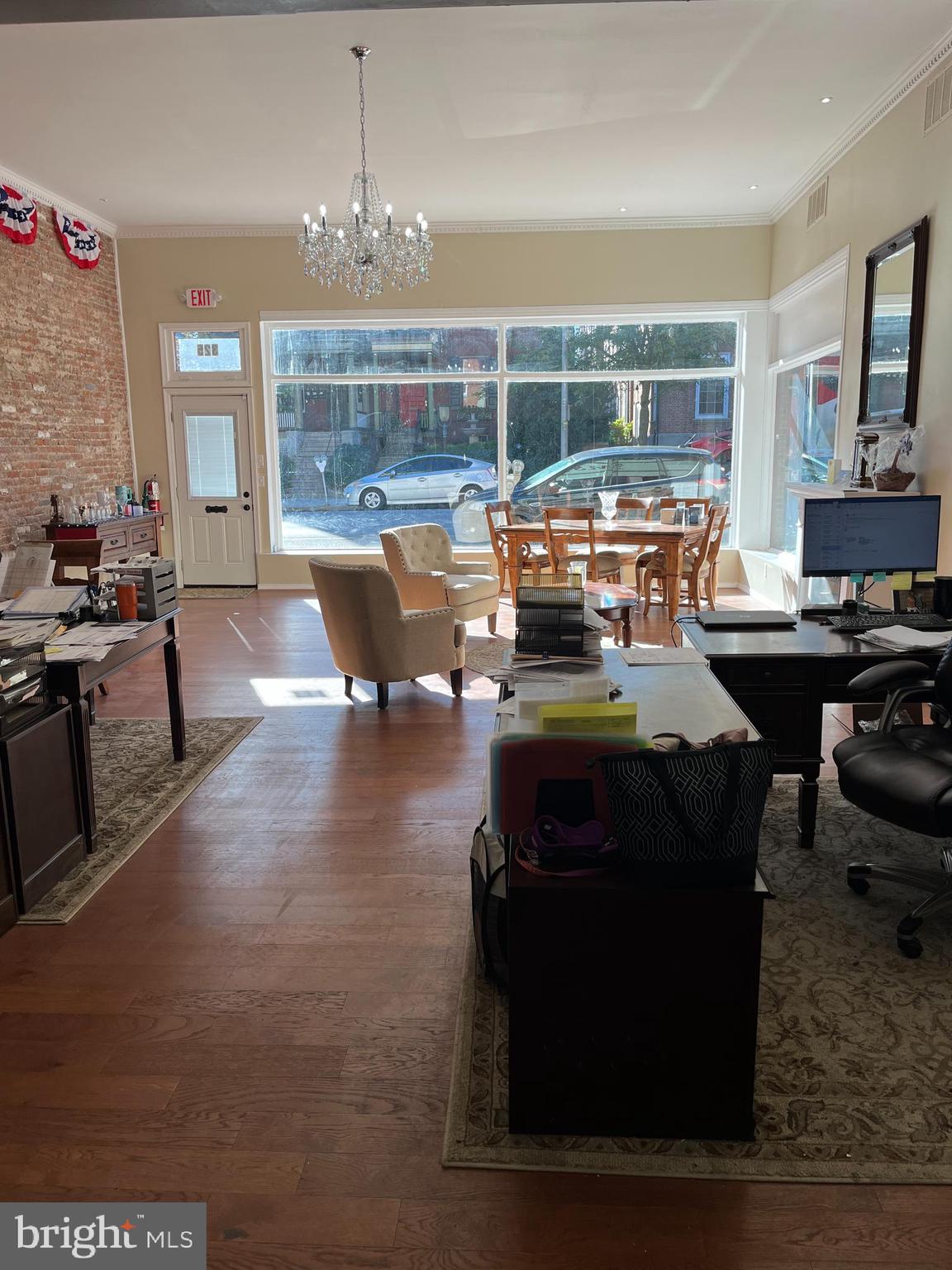 Newly Renovated Office Building in Prime Downtown York Location. This attractive, single-story office building is ideally positioned along E. Market Street/Route 462, a main thoroughfare offering excellent visibility and accessibility. The property features a spacious open-concept front office area, a loft-style private office, and a flexible side room suitable for a reception area or additional workspace. To the rear, a large production area is equipped with 200-amp electrical service and an exterior loading platform, providing functional space for a variety of business operations. Additional features include a private parking lot with 8 spaces, on-street metered parking, and two restrooms for staff and clients. Idea floor plan for a business that needs both office and/or production and storage space. Centrally located in downtown York, the property is within walking distance of major amenities including the York County Courthouse, York County Judicial Center, Yorktowne Hotel by Hilton, and the Central Market House. This renovated property offers an ideal opportunity for professional offices, creative studios, light production uses or retail in a highly visible, convenient location. Property is also for lease.
