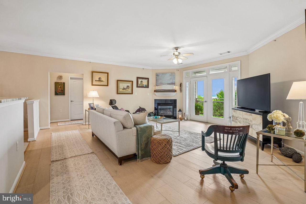1 yr warranty included!! This two-bedroom, two-bathroom condominium offers approximately 1,688 square feet of thoughtfully designed living space. The home features desirable amenities, including granite countertops, hardwood floors, and high ceilings that create a bright and airy atmosphere. The private balcony provides access to an amazing view, perfect for relaxing or entertaining. 

The kitchen is equipped with new, high-end appliances, complementing the overall modern aesthetic. A cozy fireplace and an office/den space add to the home's functionality and flexibility. Residents will appreciate the convenience of a one-car garage and the security of a gated community.

The property's prime location offers easy access to the Potomac Town Center, Wegmans, and the Marsh Walk, providing ample shopping, dining, and recreation options. The Featherstone Wildlife Refuge is nearby, offering opportunities for outdoor exploration. The home is also conveniently situated near Quantico and Fort Belvoir, ideal for those with connections to these nearby military installations.

Additional features include a new washer and dryer, as well as a storage room for additional storage space. The community also offers a club house with gym, business center, swimming pool and dog-friendly walking area, catering to the needs of pet owners.