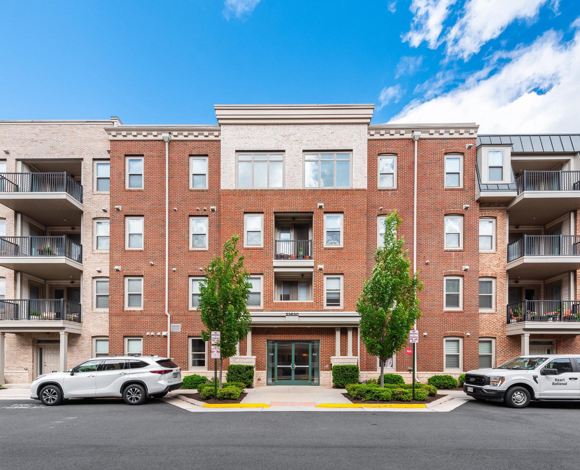An opportunity to enjoy elevated living in Brambleton’s sought-after active adult Birchwood community. Beautifully appointed throughout, this light-filled condo offers the perfect blend of modern comfort, thoughtful design, and resort-style amenities.

The open-concept layout is designed for both everyday living and effortless entertaining, with a spacious family room flowing seamlessly into the gourmet kitchen. Rich wood flooring, crown molding, and expansive windows create a warm yet sophisticated atmosphere, while the kitchen serves as the heart of the home with upgraded countertops, a large center island with seating, stainless steel appliances, and abundant cabinetry and pantry storage. A private balcony off the main living area extends the living space outdoors and offers the perfect spot for morning coffee or unwinding at the end of the day.

The primary suite offers a peaceful retreat with a spacious walk-in closet and a beautifully finished en suite bath featuring dual vanities and a large walk-in shower. Two additional bedrooms provide flexibility for family members or guests, while a separate cozy nook creates the perfect space for a home office, reading corner, or hobby area. The spacious laundry room adds everyday convenience with additional storage and a linen closet.

Additional highlights include an end-unit attached garage with direct building access located just steps from the front door of the unit, a pet washing station in the main lobby mud room, a convenient trash chute, and access to the penthouse-level lounge - the perfect extension of the home for quiet evenings, gathering with neighbors, or hosting intimate get-togethers (reservations would be required for private events).

Life at Birchwood at Brambleton is centered around connection, wellness, and convenience, with exceptional amenities including indoor and outdoor pools, two state-of-the-art fitness centers, pickleball and bocce courts, walking trails, clubhouse spaces, billiards room, social activities, a gorgeous lake, and more.

Ideally located near everyday conveniences and local favorites including Paris Baguette, Harris Teeter, restaurants, the Brambleton library, movie theater, Dulles International Airport, and major commuter routes, this beautifully maintained home offers more than just ease and convenience - it offers a lifestyle that feels effortless, connected, and wonderfully like home.