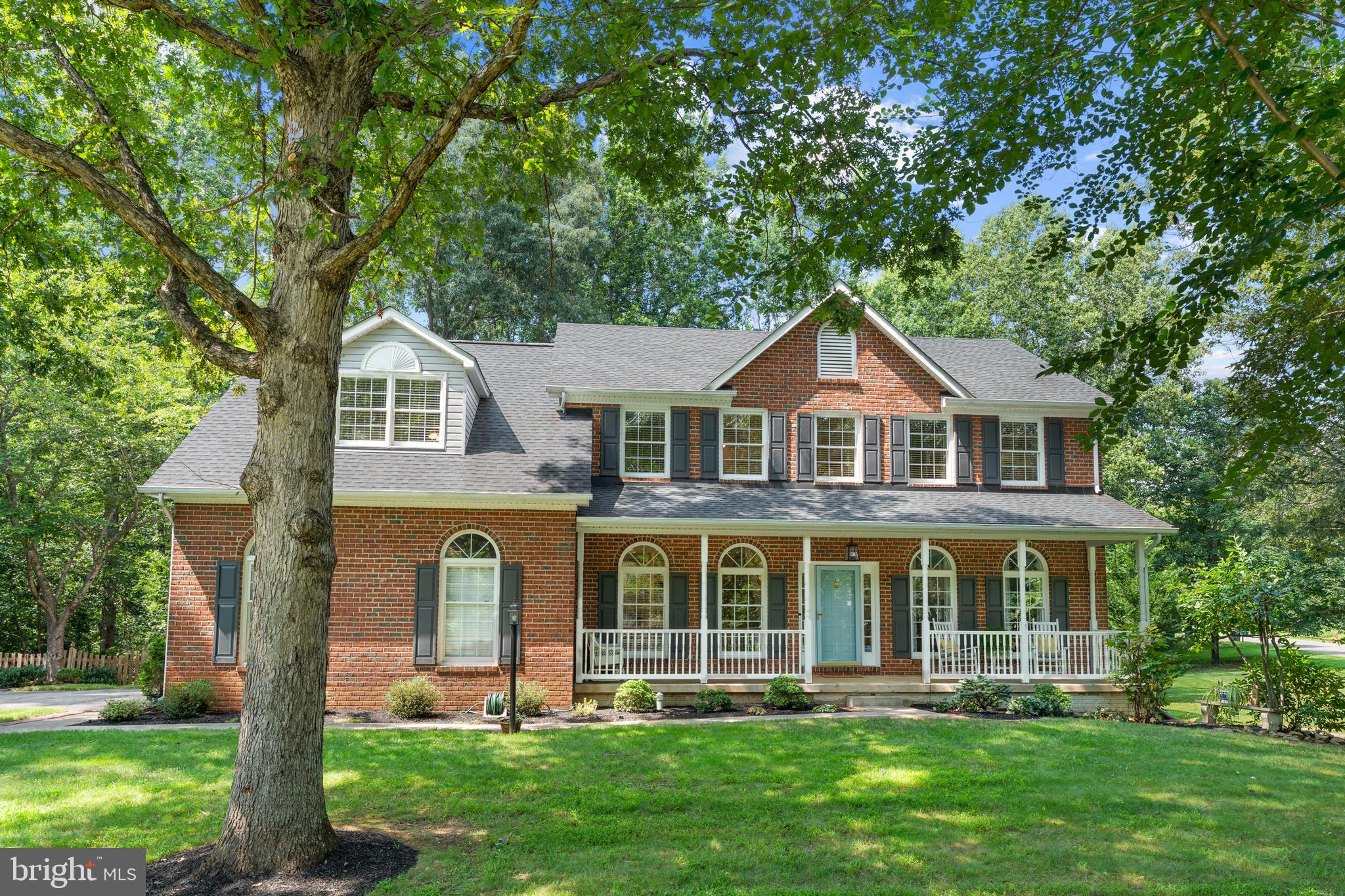 Spacious and beautifully maintained Colonial in the sought-after South Wales neighborhood, offering over 4,400 finished square feet across three levels. This 5-bedroom, 4.5-bath home sits on a 1-acre corner lot and features hardwood floors throughout the main level. The main floor includes a private office with custom built-ins, a formal living  or flex space, dining room with a bay window, and a large family room with a cozy gas fireplace. The expansive kitchen is a chef’s dream with soapstone counters, a center island with gas cooktop, stainless steel appliances with double ovens and breakfast area. Upstairs features brand new carpet, a spacious owner’s suite with a separate sitting room and large bathroom with new fixtures, plus three additional bedrooms with a Jack and Jill bathroom, and a full hallway bathroom. The fully finished walk-out basement includes a second gas fireplace, wet bar, fifth bedroom, and full bath—perfect for guests or entertaining. Outdoor living is just as impressive with a deck overlooking a fenced, level backyard with a firepit, plus a stamped concrete patio. Move-in ready and full of charm!