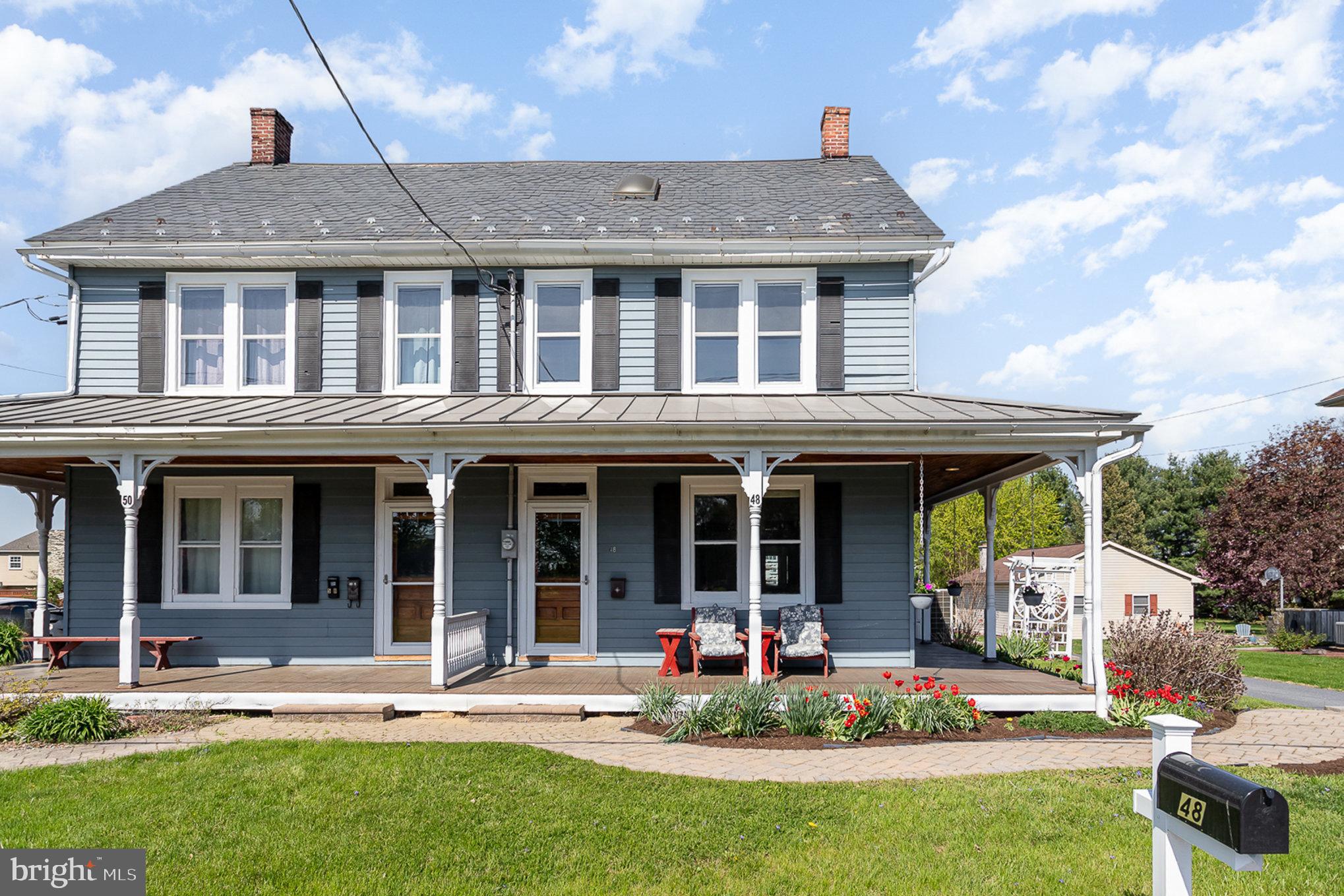 Welcome to 48 Lancaster Ave!  Charm, character, high ceilings, and over 2000 sq ft of space in this Strasburg borough home!  This 4 bedroom, 3 bath home with large rooms, storage galore, built-ins, a barn, wrap around porch and garden has something for everyone.  A perfect spot in Lampeter Strasburg school district within walking distance to the park, elementary school,  great restaurants in the square yet only a short drive to scenic farm land,  produce/ floral stands as well as the outlets and shopping. The home is a mix of modern conveniences with stainless steel appliances and granite counters in the kitchen, a beautiful sunroom, and 5 mini splits added throughout the home to provide air conditioning comfort, but maintains the beauty of original woodwork, original doors and knobs, large windows and built ins. The main floor consists of a cheery sunroom with a mudroom/ laundry room connected, a full bath, large country kitchen,  open dining room with a cozy gas burning stove, and a big bright living room. You can access the second floor from the front or rear staircase that open to a wide center hallway.  Rounding out the second floor are three large bedrooms and another full bath.  The third floor attic was converted into a fantastic 4th bedroom complete with storage cubbies and closet as well as a full bath.  Through the bathroom is another room that can be used as a walk in closet, office or storage space.  The basement is also finished and provides many options for your needs. 
Outside, the wrap around porch is an ideal spot to enjoy a sunset or cup of coffee surrounded by beautiful perennials.  From the sunroom, access a large stone patio for outdoor dining. The barn presents many possibilities for uses including parking, a workshop, storage, or your creative ideas.  Situated behind the barn is a very large garden or plant grass to round out the .33 acre property with a private backyard. The sellers have loved and maintained this home well for over 50 years and are now ready to pass it along to new owners.  Come check it out for your opportunity to live in this sweet spot!
