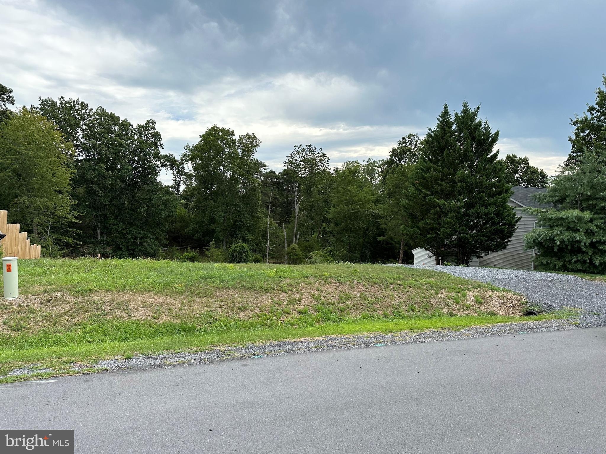 Build your dream home on Lot 13, Camden Drive in the desirable Asbury Terrace Subdivision of Winchester. This prime buildable lot offers an excellent location just off Valley Mill Road and Route 7, providing easy access for commuters while remaining close to everyday conveniences. Public utilities are available, including electricity, public water, and public sewer hookups, helping simplify the building process and save valuable time during construction. Enjoy a fantastic location near local schools, shopping, dining, and popular attractions, including Old Town Winchester, Apple Blossom Mall, and Shenandoah University. Convenient access to Route 7 and Interstate 81 makes commuting to the surrounding areas a breeze. No HOA. All sizes are approximate. The water and Sewer hookup cost to obtain. A retaining wall was built to help landscape for a level yard.
