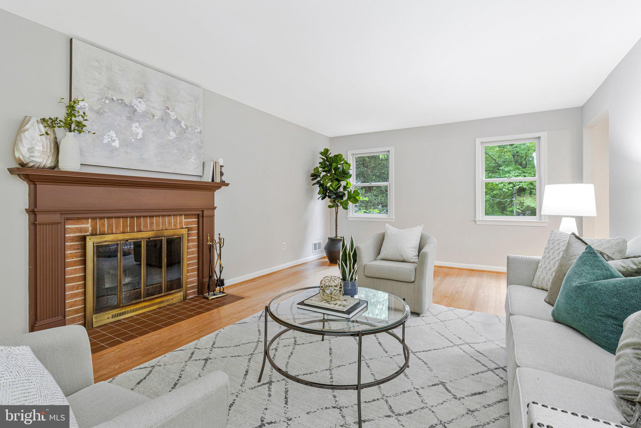 Tucked back from the road on a spacious, private lot, surrounded by trees, this inviting Alexandria home offers the kind of setting that’s getting harder to find... Country living in the city! Lots of space for play or creating a small homestead with raised beds for your own garden! The kids can enjoy walking to school on the nature trail as well as accessing the rest of the neighborhood for biking and fun. Plus you can literally walk right across the street to Grist Mill Park for sports or playtime and Mount Vernon Country Club for getting that round of golf in!

Hardwood flooring throughout. Tons of spacious bedrooms. Two large living rooms each with a fireplace for those cozy winter nights! The layout is both practical and comfortable, with an eat-in kitchen for everyday living plus a separate dining room that’s perfect for special gatherings. Just off the main living space and kitchen, the screened-in porch is a favorite spot- ideal for morning coffee or winding down in the evening without worrying about the bugs.

Out back, the yard is ready for whatever you enjoy most. There’s a firepit for cool nights, raised garden beds for growing your own vegetables or flowers, and a shed for extra storage. Whether you’re hosting friends or just enjoying a quiet weekend, the options are endless! A two-car garage adds convenience and plenty of room for parking and storage. Don't miss the brand-new roof! That is a huge expense you will NOT have to worry about!

Location-wise, it’s hard to beat. You’re minutes from George Washington's Mount Vernon, close to Fort Belvoir, and have easy access to the Mount Vernon Trail for biking, running, or just getting outside. The Potomac River adds even more ways to enjoy the area’s natural beauty. Commuting is straightforward, with convenient routes to the Pentagon and beyond. Plus you can literally walk out the door to a nearby bus stop and get to your office in DC or the Pentagon. Easily bike to work if you are stationed at Fort Belvoir (and you can actually bike to the Pentagon too for a good workout).

This is a very special place in the shadow of George Washington's historic home. Make it yours on the 250th birthday of America!