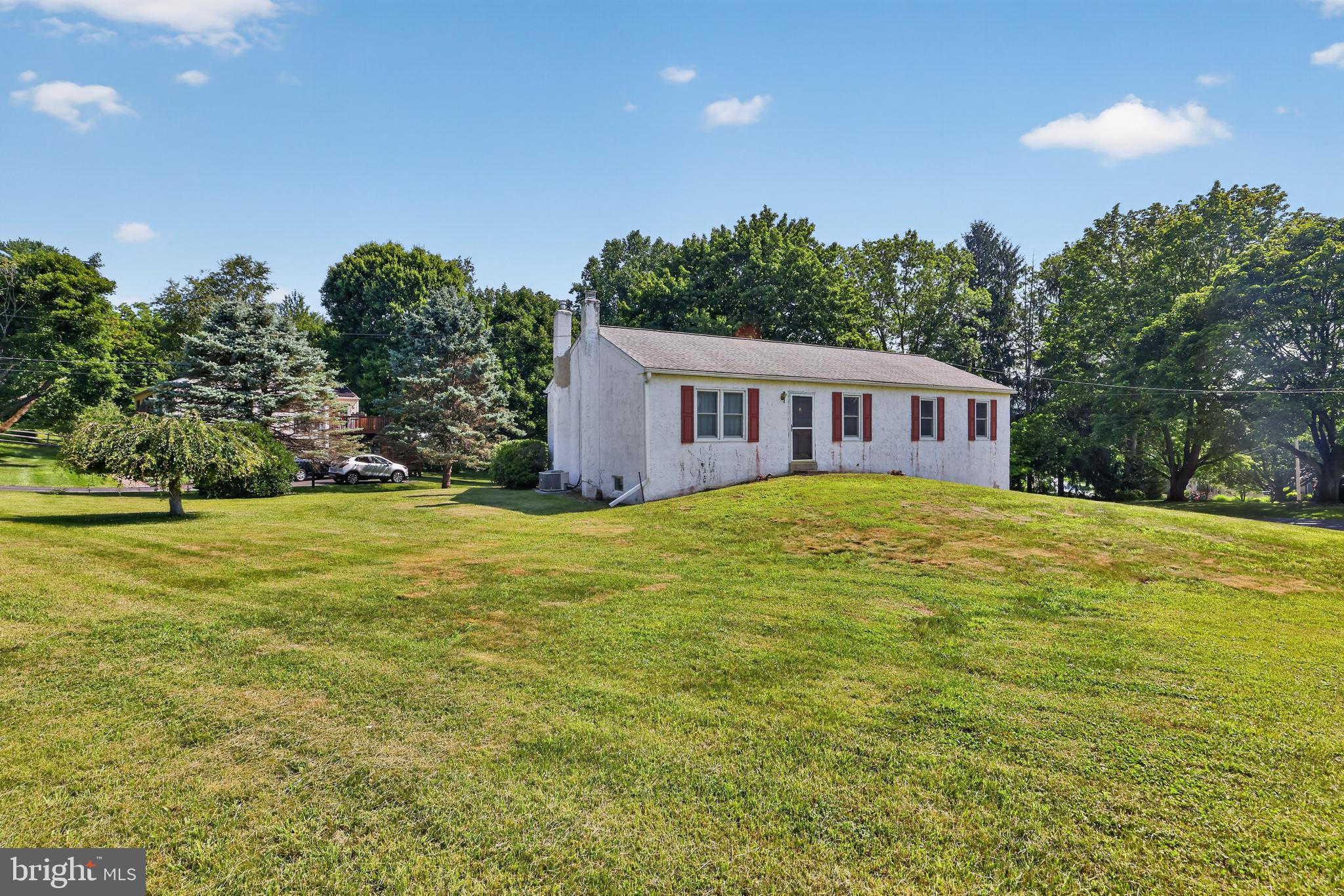 Welcome to 493 McGregor Drive, a well-loved ranch home nestled on a desirable corner lot in one of West Whiteland Township's most sought-after neighborhoods. Tucked away off the beaten path, yet just minutes from Boot Road, Routes 100 and 202, and the vibrant shops, restaurants, and attractions of West Chester Borough, this home offers the perfect blend of privacy and convenience. Offering 4 bedrooms, 2 full bathrooms, an attached 2-car garage, and central air conditioning, this home has been thoughtfully expanded and lovingly maintained over the years. The heart of the home is the beautifully enlarged kitchen, featuring a spacious center island that opens to the dining area with a dramatic cathedral ceiling, creating an inviting space for everyday living and entertaining. (Kitchen addition square footage is approximate and should be independently verified by the buyer.) Just off the kitchen, step onto the rear deck—an ideal spot for morning coffee, outdoor dining, or relaxing while overlooking the yard. Hardwood floors add warmth and character throughout much of the home, and even more hardwood flooring lies beneath the existing carpeting, waiting to be uncovered and restored to its original beauty. The expansive, partially finished basement offers endless possibilities for additional living space, a recreation room, home office, or workshop. A cozy wood stove adds warmth and charm, while the basement is already roughed in for plumbing, making it easy to add a future bathroom and further enhance the space. While the home could benefit from some cosmetic updating, it presents an incredible opportunity to personalize a solidly built home in an outstanding location. With its spacious layout, quality features, and prime West Whiteland setting, 493 McGregor Drive is ready for its next owners to make it their own. Sold in As Is condition.