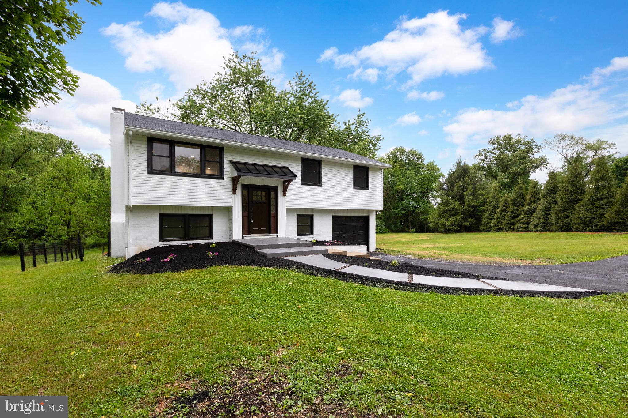 Welcome to 11 Prince Edwards Drive, a beautifully reimagined residence set on 3.3 private, tree-lined acres at the end of a quiet cul-de-sac. From its exceptional curb appeal to its thoughtfully curated updates, this home offers a rare blend of comfort, style, and tranquility. Inside, enjoy a newly refreshed kitchen, updated bathrooms, new flooring, and upgraded windows, doors, and fixtures, all complemented by a new roof and new modern heating and air conditioning systems. Outdoors, the professionally enhanced landscaping and hardscaping create an inviting setting for entertaining and everyday living, while the fenced yard offers a perfect retreat for pets.
A brand-new septic system adds even greater value and peace of mind, allowing you to move in and immediately enjoy the lifestyle this exceptional property provides. With every major update already completed, this is a truly turnkey opportunity in a serene and sought-after setting.