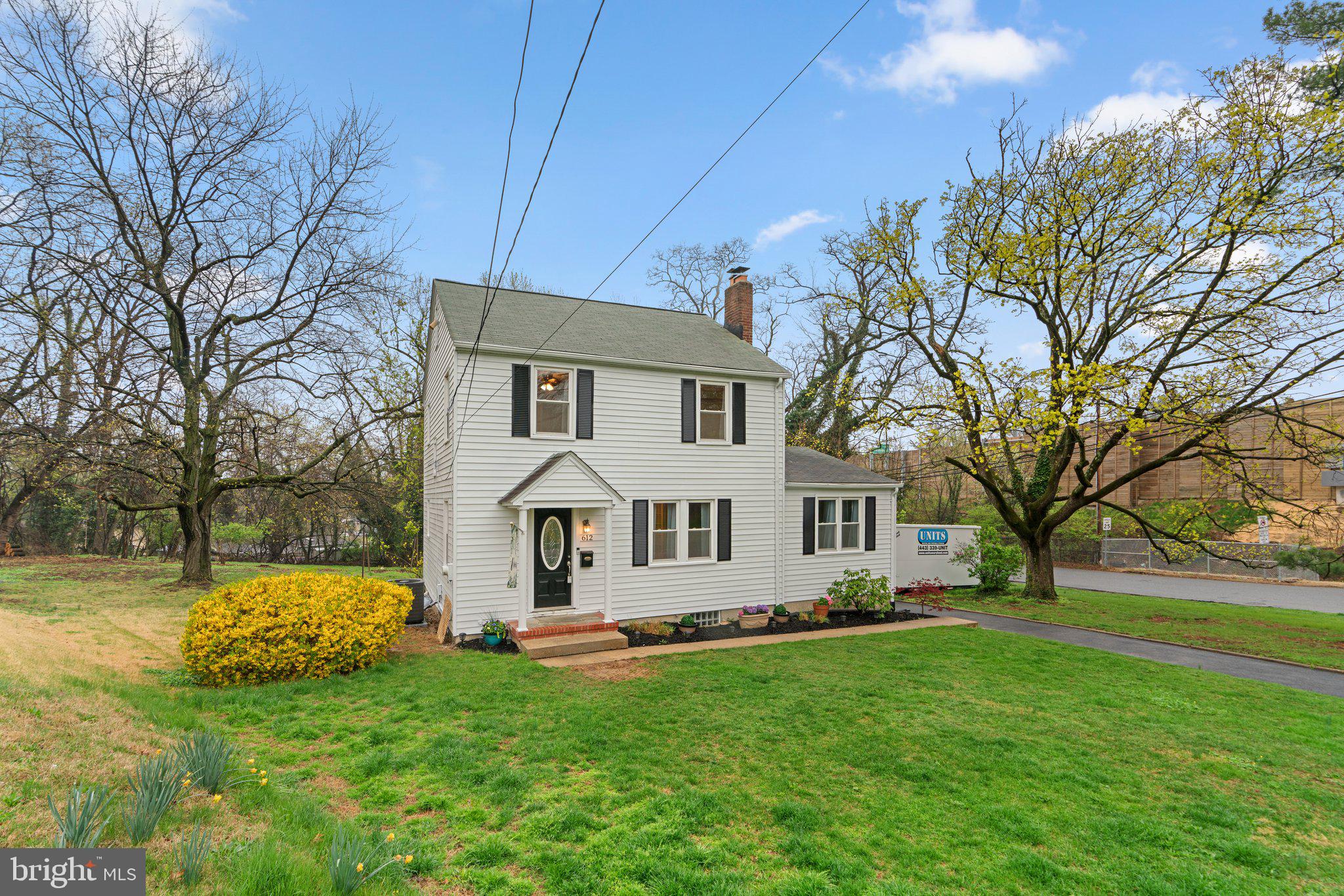 Classic Catonsville Colonial with thoughtful updates throughout, with 4 bedrooms, 1 full bath, and 2 half baths across 1,548 finished square feet, and a rarely found main level primary bedroom with attached bath! Step inside from the covered front porch to the bright and airy living room featuring a wood-burning brick fireplace with mantel, cozy built-ins, and hardwood flooring that flows through to the dining room. The expansive main level primary bedroom offers an attached half bath, walk-in closet, and built-in shelving for easy storage. The kitchen features an island, brand new stainless steel refrigerator (2025), gas range (2022), pantry, and recent LVP flooring (2024). Enjoy easy access to the screened porch, perfect for morning coffee or evening relaxation. Three additional well-sized bedrooms are located upstairs, along with a completely renovated full bathroom featuring a ceramic surround tub shower and a linen closet. The walk-up attic is floored for additional storage and offers potential for future finishing if more living space is desired. The unfinished lower level is framed for rooms, featuring a rec room area with built-in bar, an additional freezer, a utility room with a workbench, laundry area with half bath, and walkout stairs leading to the expansive rear yard. Outside, you’ll find a detached garage with attached storage shed, a long driveway providing parking for 5+ vehicles (repaved in 2020), and a spacious, park-like rear yard with lush rolling lawns and mature trees. The home’s many updates include a new gas furnace (2022), hot water heater (2019), replacement windows throughout with new front and basement doors (2017), and garage roof (2020). Perfectly positioned between the charm of Old Catonsville and the everyday conveniences of Route 40, 612 Ingleside places you just minutes from the vibrant dining, shopping, and community events along Frederick Road. And Patapsco State Park, Lurman Woodland Theatre, the Vortex at CAA Park, and the Trolley Trail are all close by for outdoor adventures. Commuters will appreciate the seamless connectivity to routes 40, 695, 95, and 195, making travel to Baltimore, Fort Meade, Washington DC, and beyond a breeze. Freshly painted throughout in soothing neutrals with crisp white trim, this well-sized, well-cared-for home is move-in ready and waiting for you!
