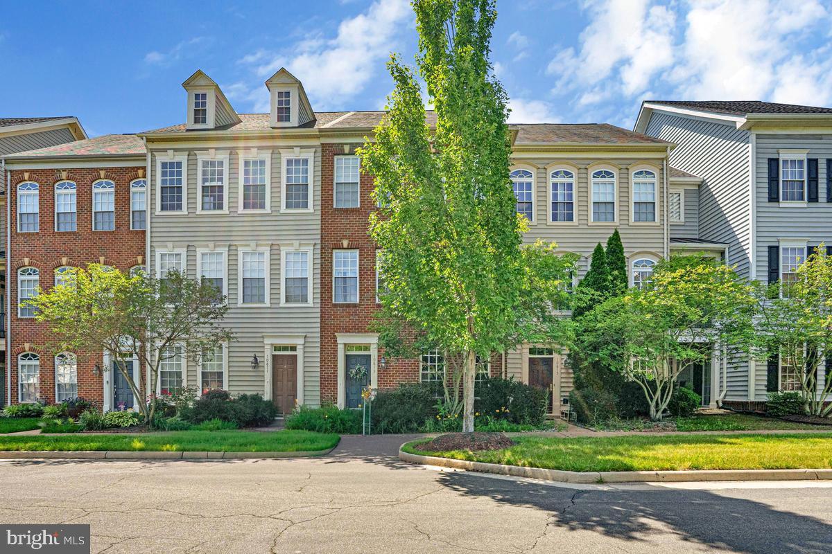 Welcome to this beautifully maintained townhome offering stylish finishes, generous living spaces, and an unbeatable location. The main level showcases rich flooring, elegant crown molding, decorative wainscoting, and abundant natural light throughout. A spacious living area flows seamlessly into the dining space and well-appointed kitchen featuring stainless steel appliances, ample cabinetry, Corian countertops, a center island, and a sunny breakfast area with direct access to the private balcony.

Upstairs, you'll find all bedrooms conveniently located on one level, along with the laundry area for everyday ease. The spacious primary suite offers a large walk-in closet and a private bath complete with dual vanities, a soaking tub, and a separate shower. Additional bedrooms provide comfortable accommodations with generous closet space.

Ideally situated near Bristow Station Battlefield Heritage Park, shopping, dining, and commuter routes, this home also offers access to fantastic community amenities, including a pool, playgrounds, tennis courts, and walking trails. A perfect combination of comfort, convenience, and lifestyle awaits.