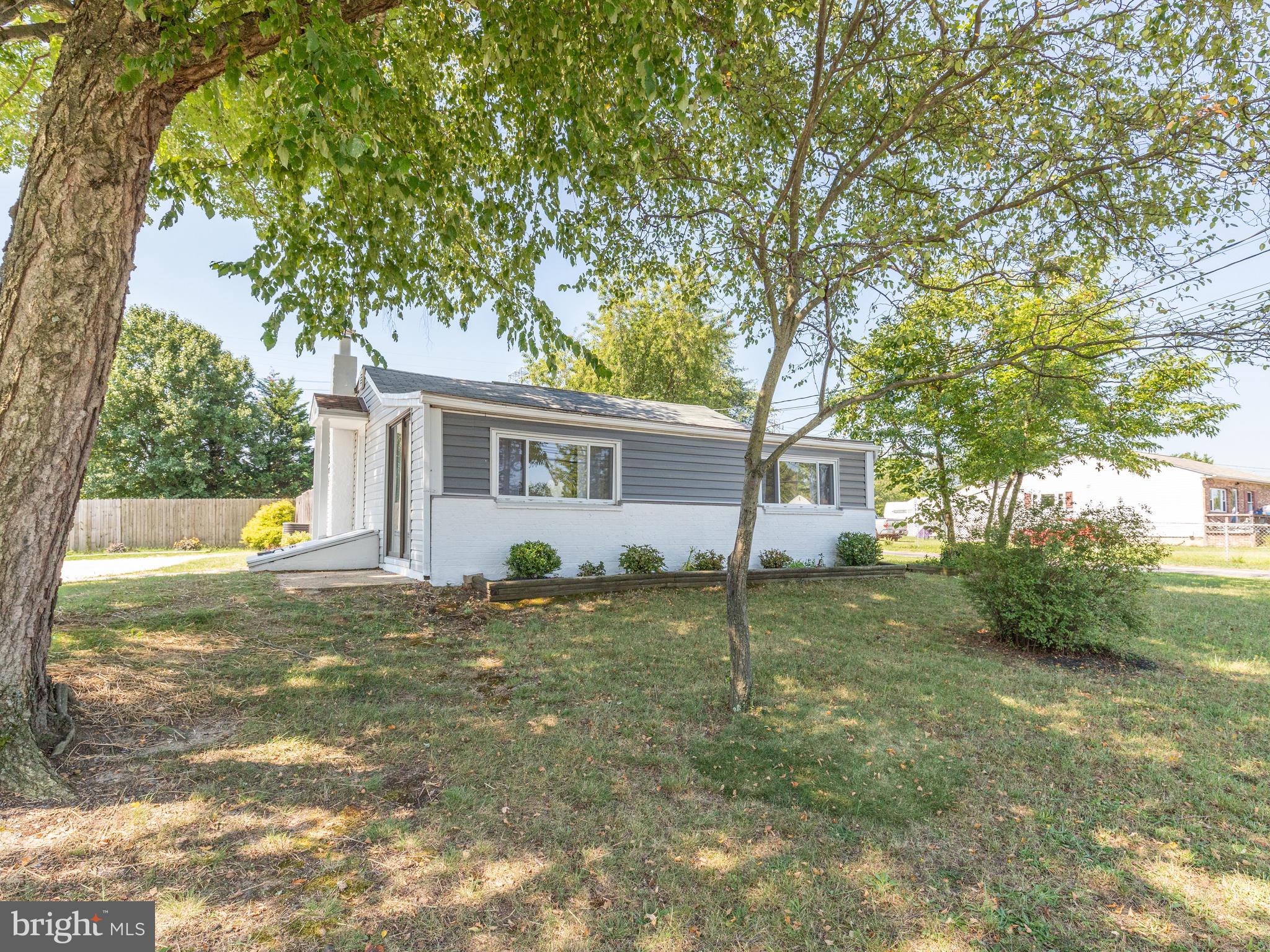 A true example of pride in ownership. Drive up to find a deep-set lot as you are welcomed by a large private concrete driveway. Your walkway will take you to the main entrance which opens to a tastefully revamped living room boasting beautiful exposed beam ceilings and HARWOOD floors throughout. From there you will find a large eat-in kitchen with plenty of room for dining. There is no shortage of counter space, sunshine or cabinetry in the kitchen. Passing back through the living area you will find three well situated main level bedrooms with plenty of closet space. Stepping out to the rear entrance onto a LARGE PATIO offering shade, room for seating and BBQ. The large FULLY FENCED rear yard is a perfect space for a private hideaway, entertaining guests, letting the dogs run or just spending some quality time together. A large shed offers plenty of EXTRA STROAGE and is also ideal for your mower, tools, and extra storage. This home is just a few minutes  walk from Marley Creek. Conveniently located near waterfront entertainment Rams head dockside, and The Beach Bar on Furnace Creek.