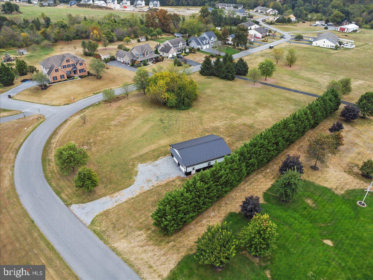 Discover the perfect canvas for your dream home in the serene Whiskey Run Estates. This expansive 1.72-acre corner lot offers a unique opportunity to create a private retreat with mountain views. The lot provides ample space for gardens, outdoor living, or whatever you envision. Nestled in a peaceful community, this lot provides the ideal balance of privacy and accessibility, making it a wonderful rural retreat while still being within minutes to local amenities. Located on the property and conveying with the sale is a 30 X 40 (1200 sq. ft.) pole barn which adds versatility, whether as an additional garage, storage or as a hobby / workshop, this building enhances the potential of this property. The pole barn comes partially pre-wired internally and just needs to be completed and tied into the existing power in the area. With its generous size and stunning surroundings, this lot is a rare opportunity to create a sanctuary tailored to your lifestyle. Here’s your chance to build a home that reflects your unique taste and vision. Embrace the lifestyle you've always wanted in a community that feels like home. Don't miss out on this incredible opportunity to build your future in a truly enchanting location. Your future begins here!