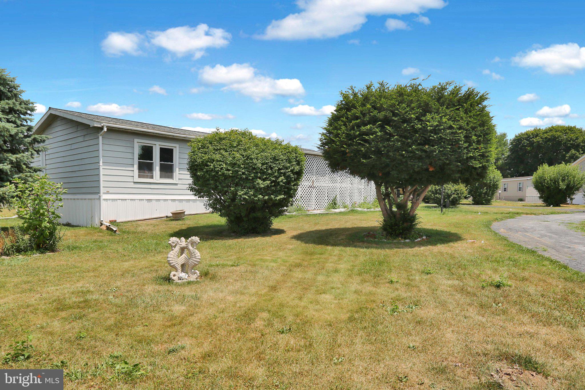 Discover the charm of this spacious double-wide manufactured home nestled in the vibrant Palm City Park community. With 1,344 square feet of living space, this 3-bedroom, 2-bathroom residence offers a perfect blend of comfort and functionality. Step inside to find a welcoming atmosphere enhanced by ceiling fans and replacement windows that invite natural light throughout. Enjoy the convenience of main-floor laundry, ensuring that chores are easily managed. The layout is thoughtfully designed with the primary bedroom and full bathroom at one end and the other two bedrooms and full bath at the other end of the home. The enclosed front porch offers another place to relax outside while enjoying privacy.  The back yard features a very large shed for additional storage, a patio, and backs up to the playground making it one of the most desirable lots in the park.   Administrator of the estate has never lived in the home.