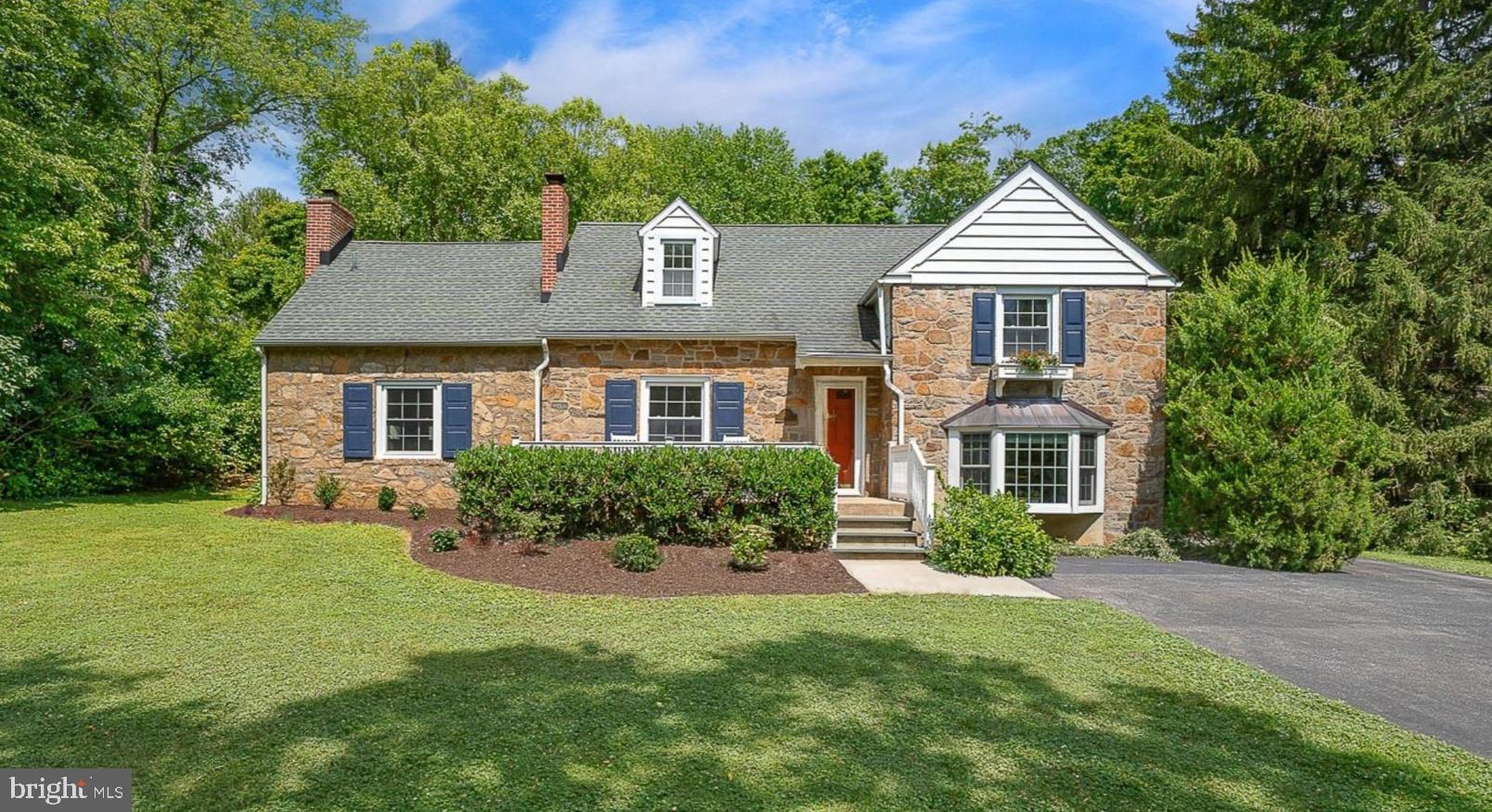 Welcome to 213 N. Fairfield Road, a charming stone 3-bedroom, 3.1-bath home set on a beautifully landscaped 0.47-acre lot in the heart of Devon. Offering a wonderful blend of character, comfort, and convenience, this home enjoys one of the Main Line’s most desirable locations, with easy access to both the Devon and Berwyn train stations, the shops and restaurants of Berwyn, TE Middle School and Conestoga High School, and just minutes from Devon Yards, Whole Foods, and countless dining and shopping destinations.
A welcoming front porch sets the tone and invites you inside. The first floor offers an exceptional flow, with distinct living spaces including a formal living room, dining room, kitchen, and family room, while maintaining open sight lines that create a connected and inviting atmosphere.
The updated kitchen is the heart of the home, featuring granite countertops, white cabinetry, stainless steel appliances, and a center island that provides additional workspace and functionality. Its central location and open-sighted lines make it ideal for both everyday living and entertaining.
The dining room is designed for gathering with family and friends, complete with a dedicated bar area and beautiful views of the backyard. Large windows showcase the patio and landscaped grounds, creating a seamless connection to the outdoor living spaces and providing a picturesque backdrop for gatherings with family and friends.
Just beyond, the step-down family room features a striking white-beamed ceiling, hardwood flooring, a fireplace, and sliding glass doors that open to the patio and backyard.
The finished lower level provides versatile additional living space, ideal for a recreation room, fitness area, hobby space, or home office. This level also includes a laundry/mudroom, powder room, and direct access to the attached two-car garage.
Upstairs, the spacious primary suite offers beautiful views of the backyard and patio, along with two large walk-in closets with built-in organizers and an ensuite bath. A second bedroom is served by an updated hall bath. The third bedroom occupies its own private level and features two closets, charming dormer windows, and an ensuite bath.
Recent improvements include fresh interior and exterior paint, new wall-to-wall carpeting in the primary suite, a new dishwasher, professional landscaping enhancements, and updates to the rear patio area.
Located in the highly ranked Tredyffrin-Easttown School District, 213 N. Fairfield Road presents a rare opportunity to enjoy classic Main Line living in a beautifully updated and meticulously maintained home.