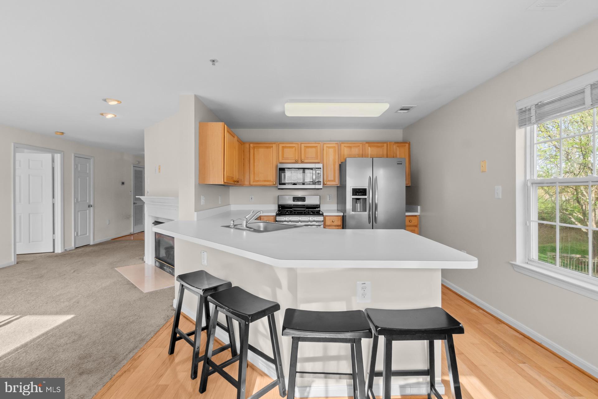 Welcome to this bright and move-in ready 2-bedroom, 2-bath condo ideally situated in the heart of Bowie. Offering two oversized bedrooms, a spacious and functional floor plan, and abundant natural light, this home is perfect for first-time buyers, downsizers, or investors alike.

The large primary suite features a walk-in closet and private en-suite bath complete with a soaking tub and separate shower. A generously sized second bedroom and full hall bath provide flexibility for guests, roommates, or a home office. The spacious kitchen offers room for casual dining, while the separate dining area is ideal for entertaining. Enjoy the convenience of in-unit laundry and relax on your private balcony overlooking the community.

Beyond the home itself, you'll love the lifestyle this location provides. Residents enjoy access to community amenities including a swimming pool, while being just minutes from Bowie Town Center's shopping, dining, and entertainment options. Outdoor enthusiasts will appreciate nearby Allen Pond Park with walking trails, playgrounds, and recreational activities, while Annapolis and Quiet Waters Park are just a short drive away for waterfront dining, boating, and weekend adventures.

Conveniently located near Routes 50 and 301, commuting to Washington, DC, Annapolis, Baltimore, Fort Meade, and surrounding areas is a breeze.

Don't miss this opportunity to enjoy comfortable, low-maintenance living in one of Bowie's most convenient locations.