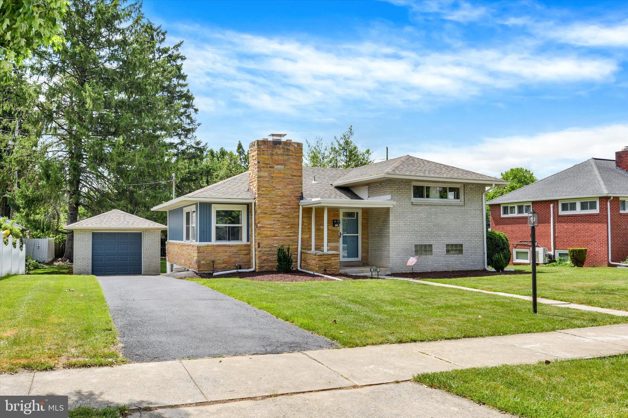Welcome home to this light and bright split-level residence nestled on a quiet street in Lemoyne. Offering multiple levels of finished living space, this home provides both comfort and flexibility for today’s lifestyle. The main level features a spacious living room with exposed beam ceilings and a cozy wood-burning fireplace, along with an updated kitchen showcasing hardwood cabinetry, granite countertops, stainless steel appliances, and ceramic tile flooring. A dedicated dining area completes the main living space. Upstairs, you’ll find two well-sized bedrooms and a full bathroom. Just a few steps below, the lower level offers a versatile layout including a rec room, a third bedroom, and an additional full bathroom. The lowest level expands your living options even further with a game room complete with a bar, a laundry area, and ample unfinished storage space. Thoughtfully maintained and updated throughout, this home features refreshed bathrooms with new flooring, vanities, and a fully tiled shower on the lower level. Major updates include a new roof and oil tank, both replaced in 2024 per previous owner. Step outside to enjoy the covered rear patio overlooking a spacious backyard—offering privacy and plenty of room for outdoor enjoyment. A one-car detached garage completes the property. This inviting home combines space, updates, and versatility—all in a peaceful location. Welcome home.