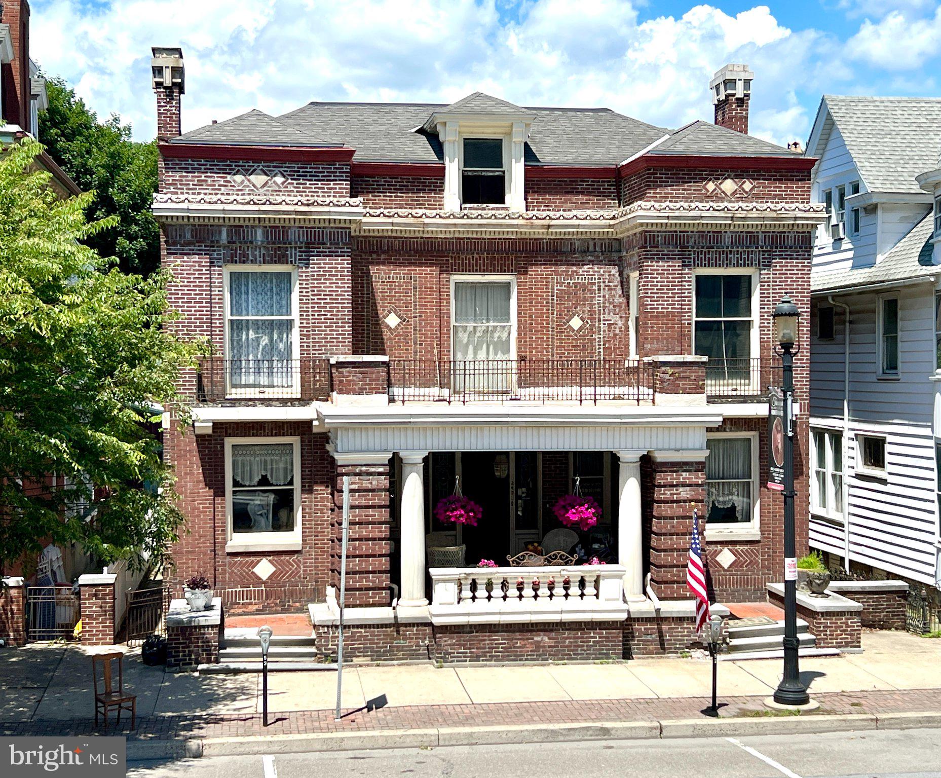 This charming home offers outstanding dual-living potential with a fully separate rental unit on the upper level—ideal for generating steady passive income from a long-term tenant, or comfortably housing family and friends. Enjoy the best of both worlds: your primary residence below with privacy and income from above.

Plus, this property presents a fantastic opportunity to participate in Pennsylvania’s CRIZ (City Revitalization & Improvement Zone) program in the borough of Tamaqua. Located in a designated revitalization area, you could leverage tax incentives and reinvested revenues to transform or enhance the home—potentially converting it into a lucrative Airbnb or short-term rental setup.

Why this is a smart buy:

•  Built-in rental income stream for hands-off cash flow
•  Flexible living options for multi-generational households or guests
•  Access to CRIZ benefits for development, improvements, and economic upside
•  Prime chance to invest in a revitalizing community with strong growth potential

Discover timeless elegance at a residence that beautifully blends classic architectural details with comfortable living. This distinguished property immediately captures attention with its grand brick facade, ornate detailing, a welcoming porch, and a walk-out balcony above, creating exceptional curb appeal. The charm continues inside with rich hardwood floors and elegant wood trim defining the inviting entryway and leading into sophisticated living spaces.

The living room boasts ornate woodworking and a decorative fireplace, providing a cozy and inviting atmosphere for relaxation or entertaining. The formal dining area, accented by an ornate fireplace and classic hardwood floors, sets a refined stage for memorable meals. The well-lit kitchen features classic cabinetry, durable hardwood flooring, and essential appliances including a dishwasher, microwave, and range, making meal preparation a delight. Upstairs, the bedrooms offer comfort and style showcasing the enduring beauty of hardwood floors and sun-filled bay windows.

Bathrooms throughout the home exude vintage charm with tiled walls, unique stained-glass accents, and classic fixtures. The property also includes a versatile attic space, offering potential for transformation into a personalized sanctuary. Complementing the main residence is a separate living area on the 3rd floor featuring two bedrooms, one bathroom, and a kitchen, accessible via steel stairs from the back of the house. 

Outside, a private, fenced backyard oasis awaits, complete with a brick patio perfect for outdoor dining and relaxation amidst verdant greenery. This home provides a unique opportunity to embrace a lifestyle of charm and sophistication in a desirable setting. Whether you want a home for your family and separate rental for a tenant or living area for your family members. This is the place for you. Homes are not just houses, they are part of our stories.

Listing agent is related to seller.