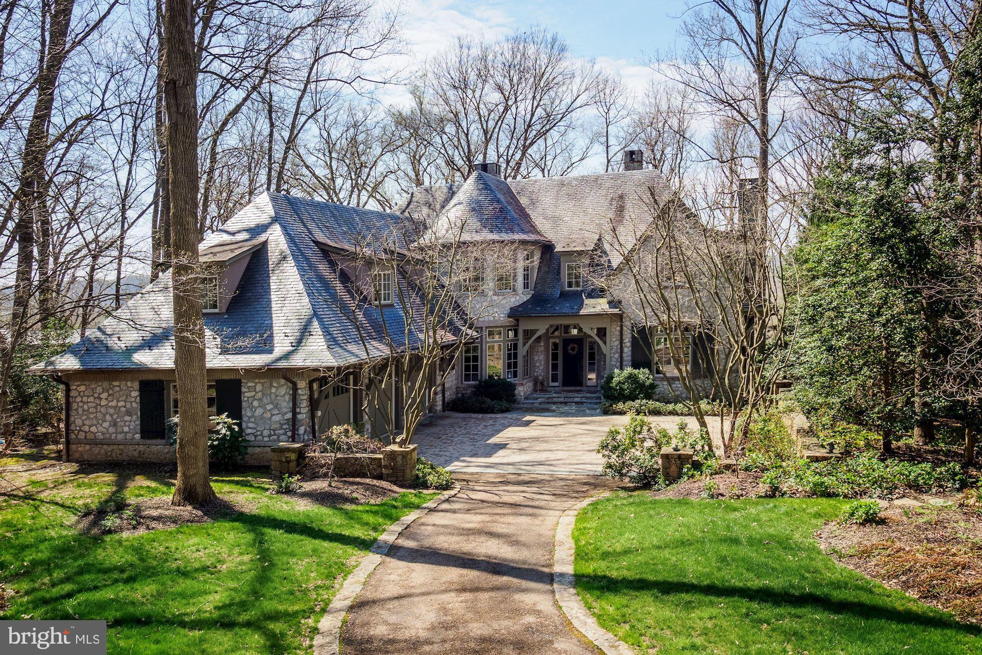 A full panoramic  view of the Potomac! One of the best river views in Merry-Go-Round Farm! Nestled at the end of a quiet cul-de-sac, this craftsman style design is reminiscent of a European country estate. A slate roof, copper gutters, rustic stonework, and moss green trim blend seamlessly with the spectacular wooded setting. Ideally sited there is a welcoming garden courtyard with three car garage and extra parking allowing the rear of the house to have an unobstructed panoramic view of the Potomac River. Exceptional quality and attention to detail is readily evident both inside and out. According to the architect,  Jim Rill, there is not a single architectural detail that was not specifically designed for this house. Extensive use of quarter-sewn oak trim and paneling add warmth and beauty throughout and compliment beautiful stonework, leaded glass accent windows, wood beams and honed Jerusalem limestone floors. From the living room with heated limestone flooring, wooded beamed ceiling, a honed marble fireplace and wall of windows to the dining room which sits in the curved turret,  to the family room with wood beamed ceiling,  stone fireplace, built in cabinetry and three sets of French doors opening to the balcony, every room is exceptional. The "Heart of the Home" is the craftsman inspired kitchen which continues the use of quarter-sewn oak paneling. Exquisite wood cabinetry with wrought brass hardware was designed by Jennifer Gilmore kitchens and is enhanced by granite countertops, tile backsplash and   heated limestone floor. The circular breakfast area overlooks the woodsy backyard and the Potomac River. The perfect place for a morning coffee!A handcrafted quarter-sewn oak paneled staircase leads to the upper level. The lovely master suite takes advantage of the extraordinary view with a wall of curved windows. Adjacent is a magnificent study or sitting room continuing the use of quarter-sewn wood paneling and trim with two walls of built-in bookshelves, a fireplace and windows overlooking the Potomac. In addition there is a bedroom with ensuite full bathroom, a sitting area and craft room with full bathroom that could also become an additional bedroom. A second staircase provides additional access to the first floor.The walkout lower level features a second family room with travertine heated flooring, a fireplace and three sets of French doors opening to a flagstone patio with stone arches overlooking the backyard and Potomac.  Two bedrooms each with ensuite bathrooms, an exercise room, a wine storage area and a storage room complete the lower level.Merry- Go- Round Farm is a special neighborhood with 81 luxury home sites surrounded by 204 acres of common area for shared enjoyment of the natural settings. Residents can enjoy walking trails, tennis courts, three lakes and an equine facility with boarding facilities; lawn care is also included in the HOA fee.