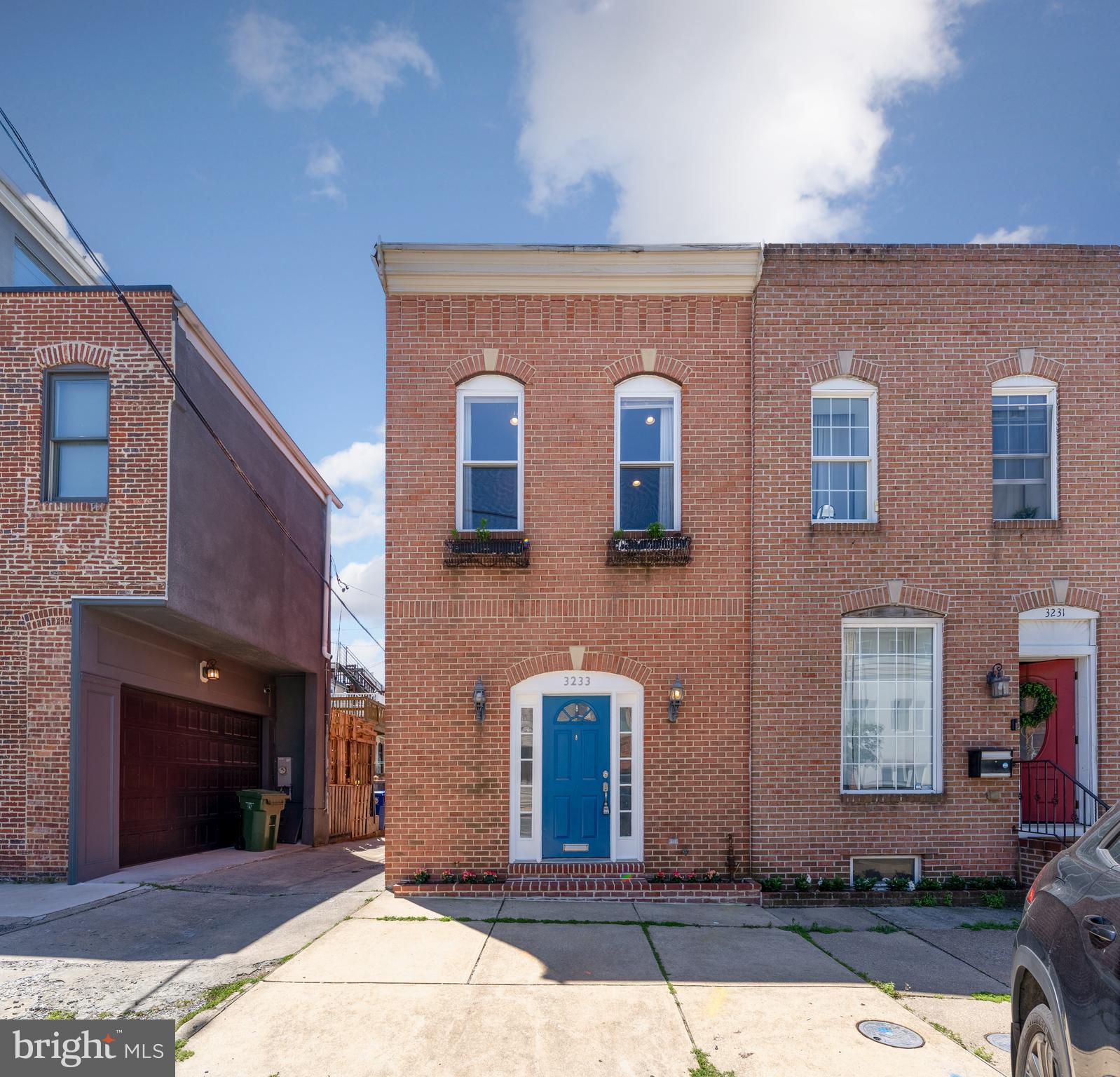 3233 Foster Ave is a charming, end of group rowhome in Canton. As you enter the freshly painted home, you are welcomed by beautiful hardwood floors and recessed lighting in the spacious living room along with the quintessential Baltimore brick wall. With the living room being just under 14 feet wide it allows for plenty of versatility to set up the space. It also seamlessly opens up to the kitchen which has stainless steel appliances, granite countertops, and plenty of cabinet space for your storage needs. As you continue towards the rear of the home there is a dining area that has plenty of natural light. It leads your very own private fully fenced in patio that is perfect to relax on this summer. The main level also includes a half bath along with a utility room where conveniently the laundry is located. The second level boasts two bedrooms each with new carpet, recessed lighting and ceiling fans. The spacious front bedroom has soaring ceilings with tall windows, allowing plenty of natural light to stream into the room. There is also a walk-in closet along with a sizable en-suite bath. The rear bedroom also has plenty of natural light and leads out to the rear deck where you can enjoy your morning coffee. The second level also includes an additional full bath and linen closet for additional storage. Buyers can also have peace of mind knowing that this home has a  Lead Free Certificate. Close proximity to Highland Town, Canton Crossing, and Canton Square where you can enjoy multiple restaurants and shopping. Enjoy the outdoors at Patterson Park and Canton Waterfront Park. Easy access to I-95 and 895. City living at its finest. You don't want to miss this one.