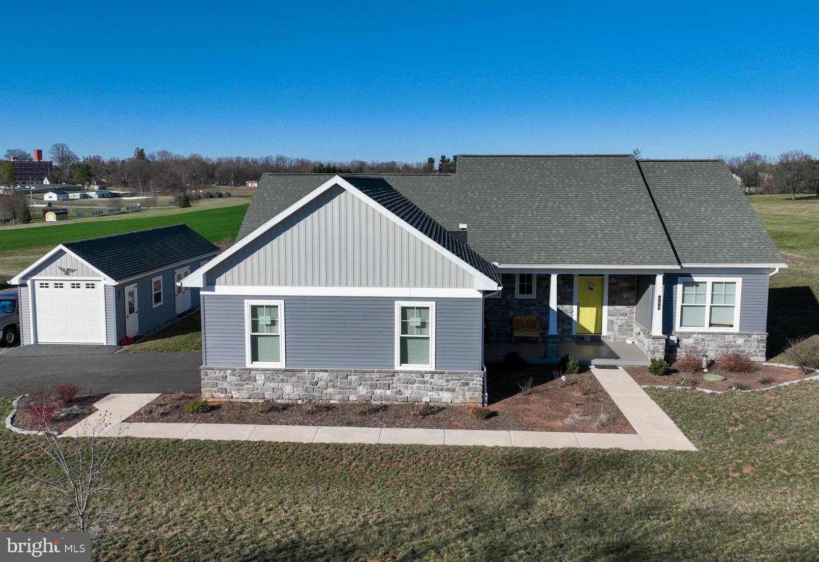BETTER THAN NEW! Just built in 2022, offers the convenience of single-level living with a bright, open layout. Set on a spacious half-acre lot - directly across from Cove Outlook Park with a walking trail. Oversized attached garage with an additional detached garage! The main living area boasts beautiful wood plank flooring and a seamless flow, making it ideal for entertaining. The chef-inspired kitchen features a generous breakfast bar, dining area that leads out to the maintenance-free deck, sleek granite countertops, and modern, soft-close cabinetry. The spacious primary bedroom includes a walk-in closet with built-in drawers and shelving, while the en-suite bathroom offers a double vanity and walk-in shower. On the opposite side of the home, you’ll find two additional bedrooms with a convenient Jack-and-Jill bathroom. The lower level, with its superior wall foundation, offers great potential to be finished for additional living space. The exterior offers plenty of storage and parking with an oversized two car garage and storage shed. Great location! Walking distance to schools, parks, restaurants, and local amenities. Easy commute to Rt. 30, 283, and the PA Turnpike.