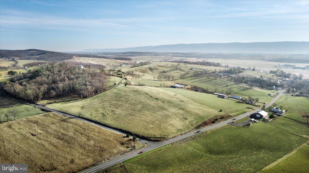 Do you want to get out of the city and build your dream home or homes, with a view? Look no further! This stunning piece of pastoral land is cleared and ready for you and all of your plans! Almost nine acres of rolling fields is the perfect setting for your 360 degree views of the Blue Ridge Mountains throughout every season! Located just off of I-81 south and within minutes to all major commuter routes, the quaint town of Mount Jackson and Bryce Ski resort, this piece of land allows you to truly immerse yourself in the Shenandoah Valley. Already approved for well and septic, bring your chickens, horses or cattle, and enjoy paved roads up to the property. The surrounding area provides you with ample activities including highly acclaimed winery's/cidery's/brewery's, the Shenandoah National Park, mountain biking, hiking, lake/river activities and of course, skiing! An unbelievable opportunity to own and build on one-or three- of the first lots in the new "Shadow Lands" Subdivision.  Come and see all that it has to offer for yourself!