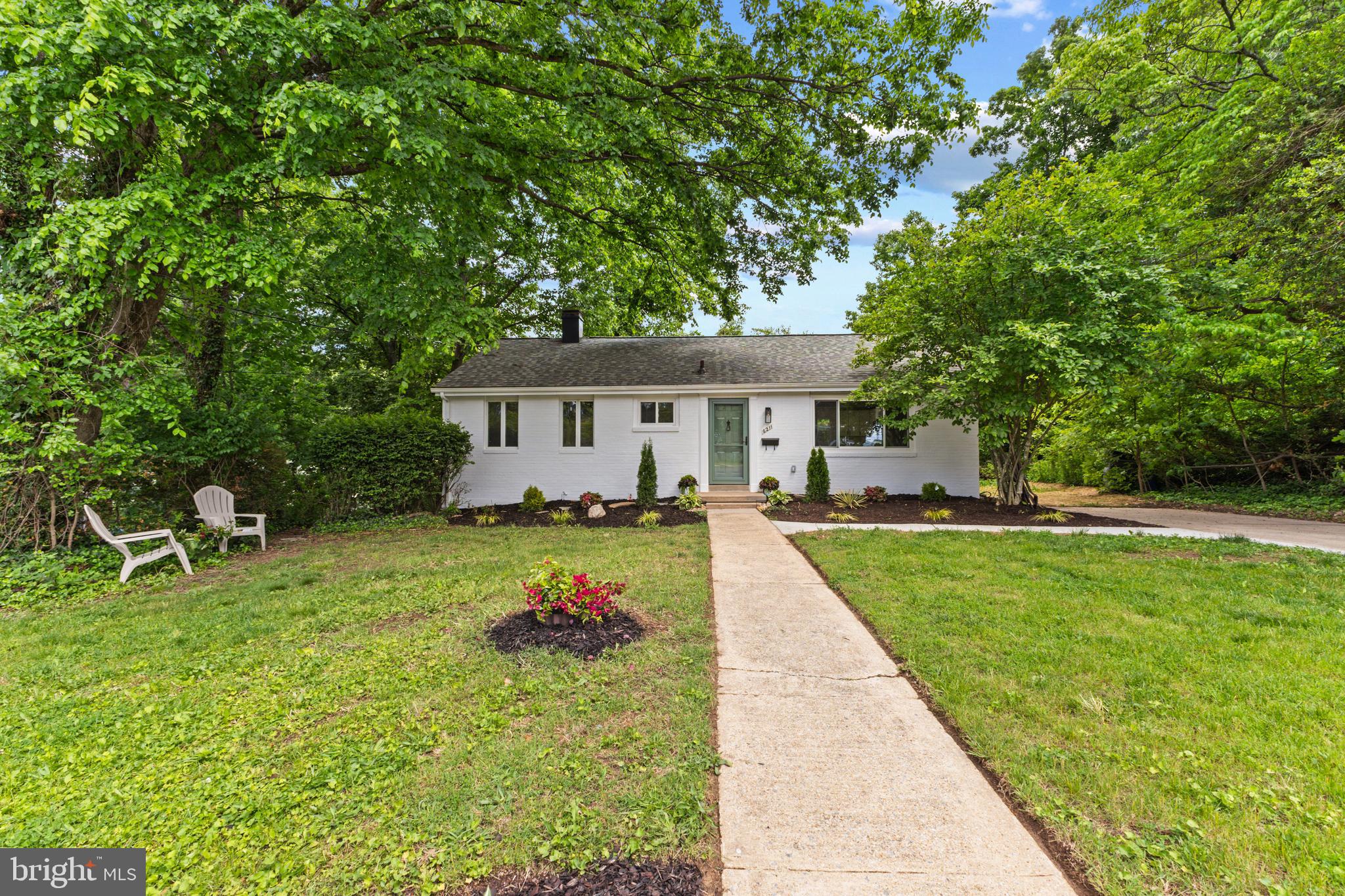 Experience the charm of this beautifully updated ranch rambler nestle in the sought-after Virginia Hills Community. Thoughtfully redesigned with modern finishes and an open-concept layout. A true standout, this home features a stunning renovated kitchen with skylight that brings lots of natural light, white shaker-style cabinetry, stainless steel appliances, quartz countertops and  backsplash. Enjoy seamless indoor-outdoor living with a spacious deck-perfect for relaxing or entertaining. Throughout the main level, you will find gleaming hardwood floors, recessed lighting and stylish updates that enhance the home's warm contemporary feel. The main level features a spacious primary bedroom complete with an enormous walk-in closet and a luxurious primary bath showcasing a large glass-enclosed shower, The second bedroom is generously sized and filled with natural light from three windows, complemented by a nicely  appointed bathroom conveniently located in the hallway. The fully finished basement has been upgraded with stylish touches throughout and features an additional bedroom. a private office, a large recreation room with fireplace, two sliding doors that lead to the large concrete patio perfect for gathering. The lower level also features a brand new shower, spacious laundry area with a utility sink, and huge storage room. The property offers a large driveway with room to park  up to 3 vehicles, Ideally located near Old town, kingstowne, and mayor roads.