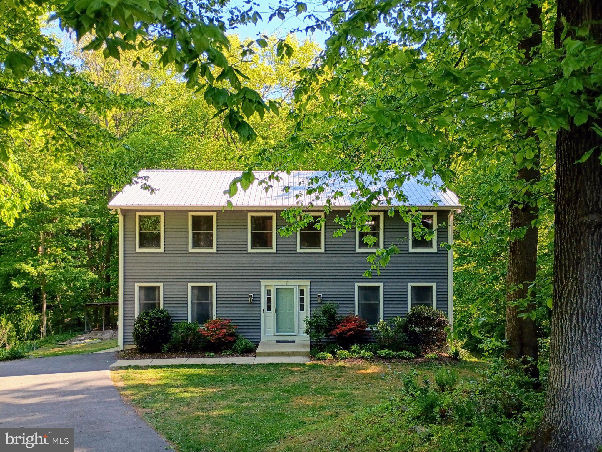 Welcome to this beautifully maintained 5-bedroom, 3.5-bath home situated on 3 private acres located on a quiet dead-end street, offering space, privacy, and convenience all in one.The home features an updated kitchen and renovated bathrooms, along with a finished basement complete with a second kitchen, bedroom, full bath, and separate entrance, creating excellent flexibility for guests, extended family, or multi-generational living. Major system updates provide peace of mind, including a NEW water heater, NEW HVAC systems (2023 & 2026), a metal roof (2015), and new vinyl siding (2021). Polybutylene (Poly B) plumbing was identified during a prior home inspection. Seller is willing to provide up to a $5,000 escrow/credit toward replacement of the polybutylene piping with an acceptable offer. Enjoy everyday functionality with a convenient mudroom and outdoor living on the spacious deck overlooking a private backyard. The property is ready for your homestead dreams, perfect for chickens, gardening, or simply enjoying wide-open space. With no HOA, a highly rated school district, proximity to area beaches, restaurants, entertainment and an ideal commuter location, this property offers the best of peaceful living with easy access to everything you need. Make your appointment today.
