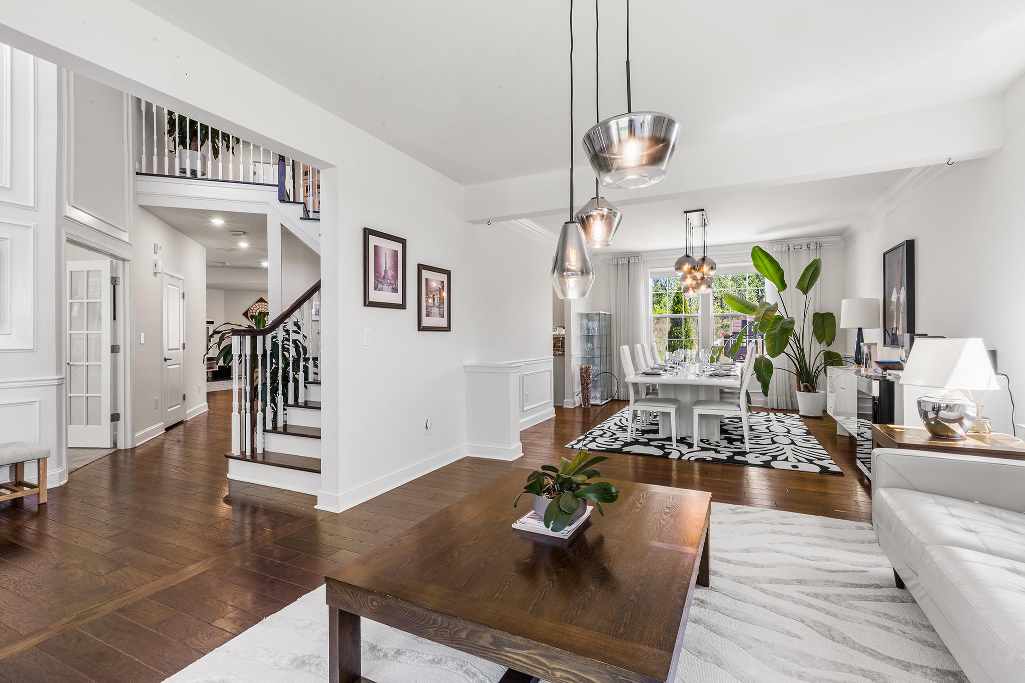 Tucked away at the end of a quiet cul-de-sac in the highly sought-after Byers Station II community,  you will find 3712 Winthrop Way.  This stunning 5-bedroom, 4.5-bathroom home delivers 5,225 sq. ft. of turn-key luxury living .Step into a sun-drenched, two-story foyer accented by elegant wainscoting and beautiful hardwood flooring.. The intelligent, open-concept main level effortlessly transitions from a private home office behind French doors to an expansive living and dining area perfect for hosting. The heart of the home is the gourmet eat-in kitchen, boasting quartz countertops, a generous island, stainless steel appliances, a walk-in pantry, and a dedicated workspace. Unwind in the adjoining family room anchored by a cozy gas fireplace, or step outside to your private oasis—featuring a composite deck perfect for alfresco dining or host cocktails on the  lower stone patio overlooking a sprawling, flat backyard. Upstairs, the palatial Owner’s Suite offers a dramatic tray ceiling,  walk-in closets, and a spa-like ensuite. Four additional bedrooms (including a guest suite with a private bath) and a dedicated laundry room complete this level. The beautifully finished lower level is an entertainer’s dream, featuring a media lounge, a built-in wet bar, a full bathroom, a dedicated exercise space, and ample storage. Enjoy resort-style community amenities including an outdoor pool, clubhouse, play grounds, fitness center, tennis/pickle ball and scenic walking trails throughout the community.   Convenient to shopping,  restaurants, entertainment  and more, easy connections to major highways and  just 15 minutes from the Downingtown SEPTA station.  This is a stunning home in a fabulous community.  Schedule your appointment today