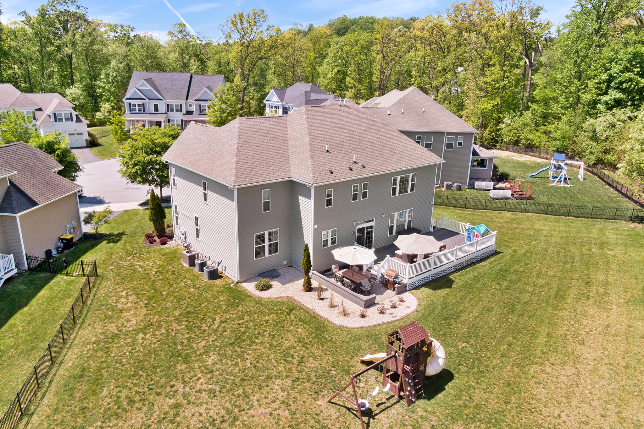 Welcome to 3712 Winthrop Way, Chester Springs.   This like new construction home with more than 5000 sq. ft.  offers 5 designated bedrooms on the upper level as well as 3.5 bathrooms. offering a spacious, light filled open floor plan to meet the demands of today's busy lifestyle. Living in Byers Station offers a fabulous lifestyle and residents can enjoy many  amenities including an outdoor pool, clubhouse, play grounds, fitness center, tennis/pickle ball, basket ball courts and scenic walking trails throughout the community as well as other social activities through out the year.   As you step into the home take note of the beautiful crown molding and wainscoting accents throughout the main level.  The home's open-concept floor plan effortlessly transitions from a private home office with  French doors to an expansive living and dining area perfect for hosting intimate or large gatherings.   The heart of the home is the gourmet eat-in kitchen, boasting quartz countertops, island , stainless steel appliances, a walk-in pantry, and storage area.  Unwind in the adjoining family room anchored by a cozy gas fireplace, or step outside to your private oasis—featuring a composite deck perfect for alfresco dining visiting with family and friends on the  stone patio overlooking a sprawling, flat backyard. Upstairs, the palatial Owner’s Suite offers a dramatic tray ceiling,  walk-in closets, and a spa-like ensuite. Four additional bedrooms (including a guest suite with a private bath) and a dedicated laundry room complete this level. The beautifully finished lower level is an entertainer’s dream, featuring a media lounge, a built-in wet bar, a full bathroom, a dedicated exercise space, project room and storage area.   Convenient to shopping,  restaurants, entertainment  and more, easy connections to major highways and  just 15 minutes from the Downingtown SEPTA station.  This is a stunning home in a fabulous community.  Schedule your appointment today