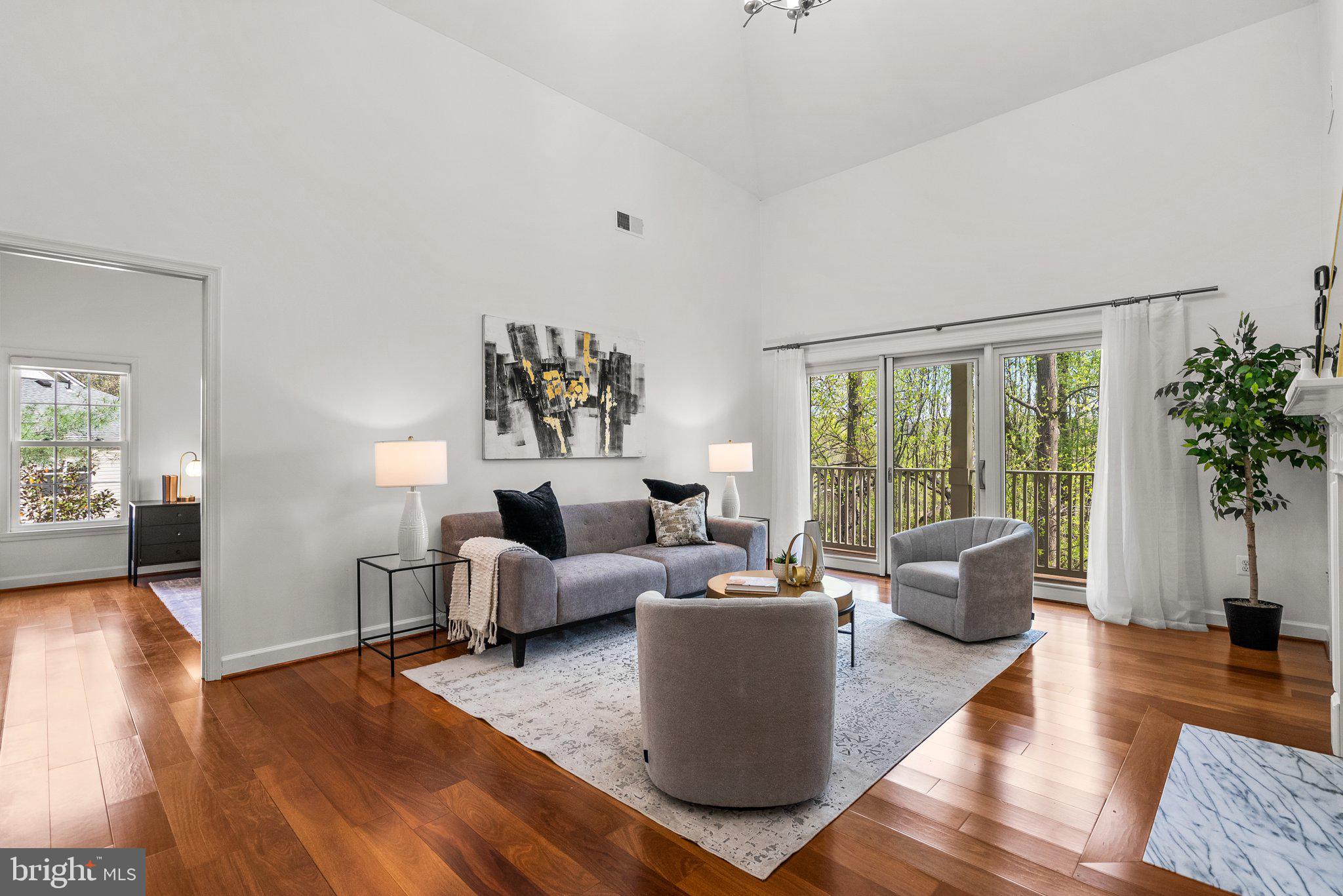 OFFER DEADLINE: Please submit best and final offers by Tuesday 4/29 at noon. Go see the rest and save the best for last - you won't be disappointed. Step into this beautifully maintained condo featuring soaring vaulted ceilings, gleaming hardwood floors, and three true bedrooms and three full baths. The main level features a well-designed layout and a stunning, newly renovated kitchen complete with brand-new cabinets and sleek stainless steel appliances, a separate dining area, and an airy living room with a gas fireplace. Enjoy the tranquility of the outdoors from the spacious rear balcony, accessible through sliding glass doors—perfect for unwinding with views of the trees and creek. The main level includes two generously sized bedrooms, each with its own ensuite bath and walk-in closet. Upstairs, the spacious loft level overlooks the living room and includes a third bedroom, full bath, and a large laundry/storage room with built-in shelving for convenience. Located just minutes from I-270 and Route 355, with easy access to public transportation. You'll love being close to Crown, Rio, Sugarloaf Mountain, parks, the Decloverly Community Pool, and a wide variety of shops and restaurants. Additional perks include plenty of parking and a dedicated storage unit in the building corridor. This one won’t last long—schedule your tour today!