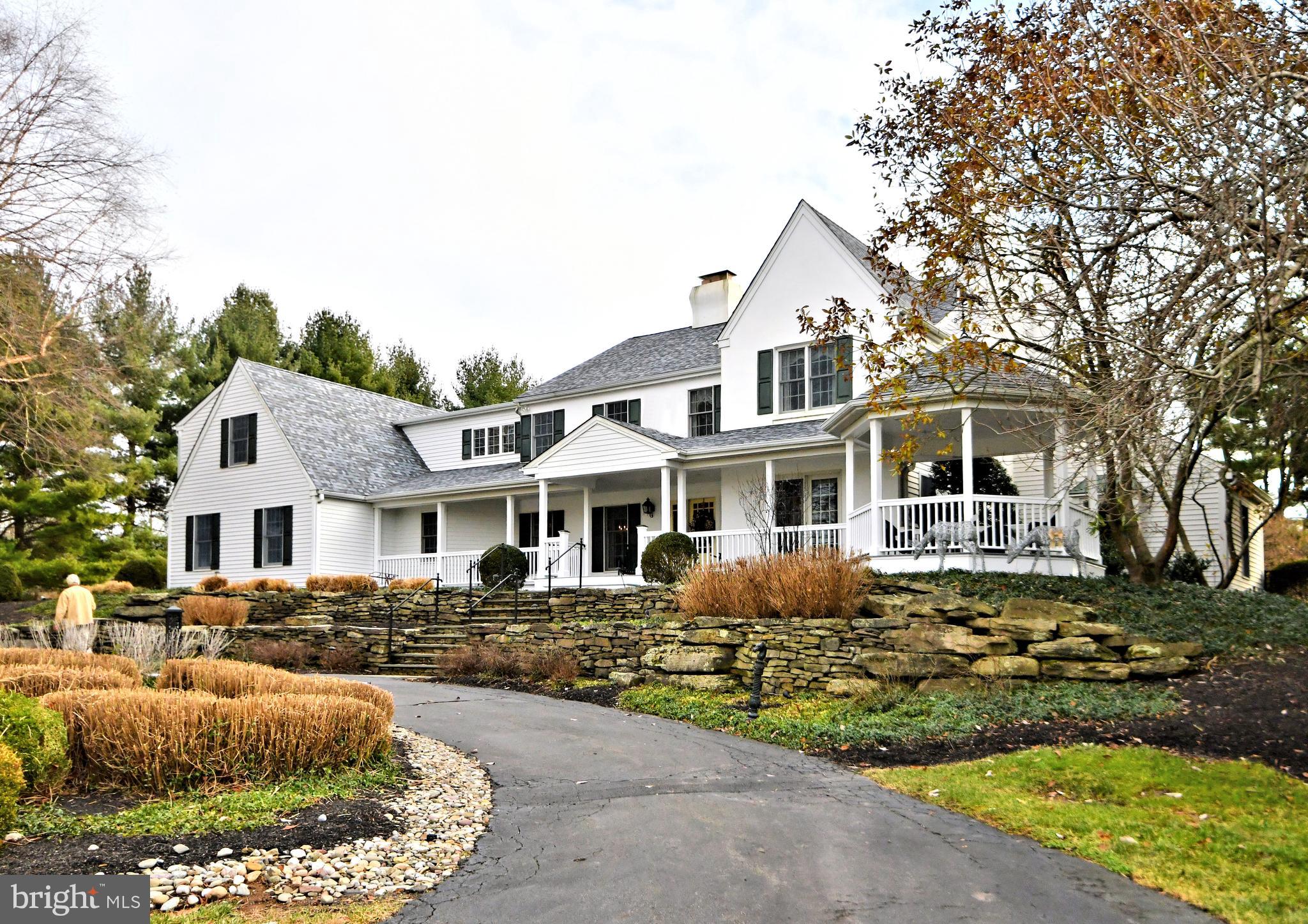 A long winding driveway leads over a small bridge to this magnificent home situated on a ten acre parcel! Enjoy long distance views, professionally landscaped gardens and circular driveway supplying ample parking for guests! Enjoy  relaxing on the full wrap around porch  while taking in those peaceful long distance views. This home has been completely remodeled and expanded during this homeowners tenure.
Enter to a 2 story hardwood foyer with turned staircase, to the left and right are the formal areas of the home, the dining room and formal living room with fireplace. Each perfect for entertaining! To the rear of the home is a large remodeled kitchen with center island and premium appliances. Adjacent, a breakfast room with large Colonial walk in wood burning fireplace and walls of windows and atrium doors overlooking the rear grounds! Enter to an extremely welcoming family room / great room with wall to wall gas fireplace, custom bar for entertaining and with plenty  of natural sunlight filtering in from the windows. This home features a first floor 2 story study, with custom built ins and convenient back staircase. 1st floor laundry, mud room, powder room and 3 car side entry garage complete this level.
Above, are 5 bedrooms, including a large master suite with plush carpeting, fireplace, private rear staircase to the 1st floor library, 2 large walk in closets and remodeled private bath with soaking tub. The 2 additional bedrooms have private baths and then there is an additional hall bath to service the additional bedrooms.
Below is a full unfinished basement with crawl space. 
The magnificent rear yard features a custom inground pool with spa, pergola, slate walkways, fencing, pool house and spectacular landscaping! Perfect for summertime entertaining!