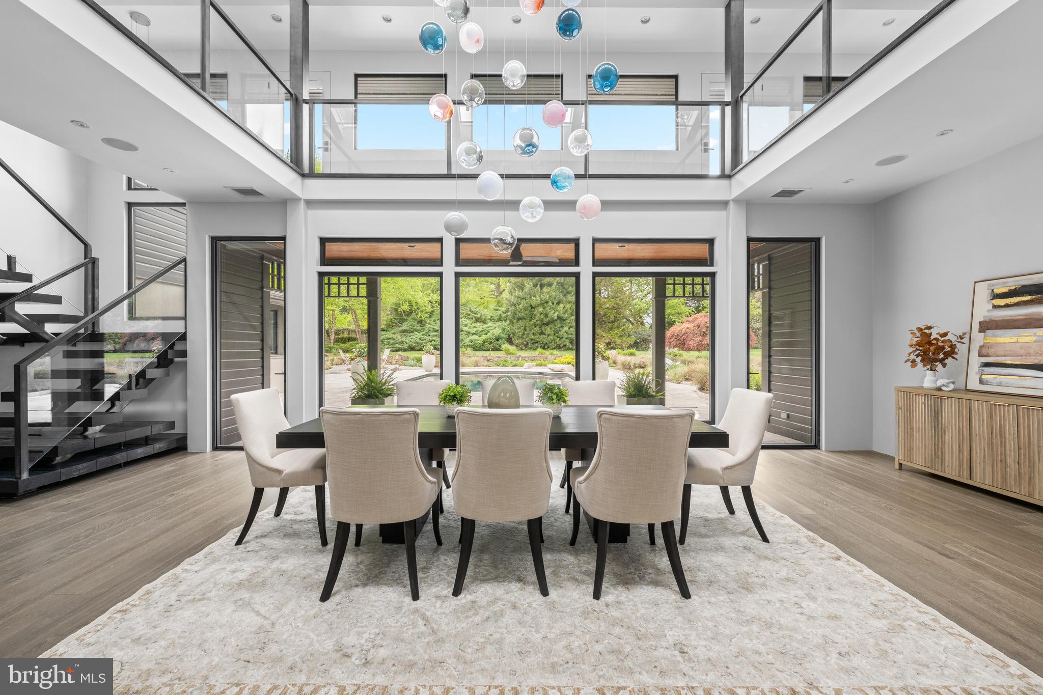 Nestled in the heart of Villanova, 850 Lesley Rd is a modern masterpiece that seamlessly blends contemporary design with the serenity of nature. Thoughtfully updated to bring the outdoors in, this home redefines comfortable, stylish living, while connecting you to its landscape from the moment you step inside. This home is perfectly situated on two of the most breathtaking acres in Radnor Township. The living and dining areas have been unified by an open floor plan that boasts soaring ceilings and expansive glass walls, effortlessly linking indoor and outdoor living spaces. Natural light pours into the heart of the home, illuminating the exquisite resort-like pool, an impressive screened-in gazebo, with room for a dining table and sectional couch, designed by Archer Buchanan and an enchanting backyard oasis. This intelligently designed layout leads you into two distinct wings that separate family-friendly spaces from luxurious first-floor bedroom suites. Experience the seamless flow from the gourmet kitchen with a dedicated breakfast area to the library / sitting room and the family giant screen TV room with a beautiful front garden view and modern French door access to it. . Notable features include hard wood and tile flooring, stainless steel countertops, top-of-the-line commercial appliances, and magnificent cabinetry with built-ins. This area is complemented by convenient mud and utility rooms featuring elegant river rock flooring and an attached three-car garage all with extensive storage space. The adjacent wing boasts two spacious bedrooms, a hall bath, and an exceptional Primary Bedroom suite that features a spa-like bathroom retreat including a steam shower. The stunning open solid Oak staircase, also designed by Archer and Buchanan, leads you to the second floor, where a bridge spans the entire length of the house, creating a gallery that overlooks the breathtaking backyard. Each wing is thoughtfully designed, offering two bedrooms with adjoining baths, as well as two fabulous bonus rooms that can easily serve as an office, game room, gym, or studio. Outside, the flow continues with beautifully landscaped grounds that feel like an extension of the home itself. Stone pathways wind through the gardens and mature trees, leading to inviting spaces throughout the property. The partially finished basement provides additional storage. Most systems in the house have been completely updated, and now features a whole home (including outdoor pool area) mesh Wi-fi network that supports a fully automated and app controllable heating and cooling, lighting, whole house audio and video system as well as pool filtration equipment, including a salt chlorine generator.  Heating and cooling is provided by five air handlers and two radiant heat hot water heater furnaces with a total of 21 heating and 13 cooling zones independently controllable and schedulable.
. Most recent improvements include a completely repainted exterior, extensive tree planting, and re-paved/sealed driveway 850 Lesley Rd is more than just a home—it’s a statement. Combining contemporary luxury with natural beauty, this property offers a truly elevated lifestyle in one of Villanova’s most sought-after locations.
