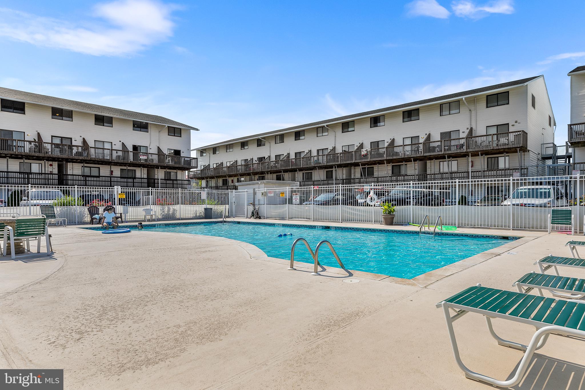 Experience coastal living at its best in this charming 1-bedroom, 1-bath condo at Jockey Beach Club PH 03, ideally located in desirable North Ocean City just steps from the Atlantic. The open-concept living area allows the kitchen and living room to flow seamlessly, creating a relaxed space for everyday living or entertaining after a day at the beach. A private balcony extends the living space outdoors, perfect for enjoying ocean breezes and sunset skies. The spacious bedroom and full bath are thoughtfully designed for comfort, while in-unit laundry adds everyday convenience. Residents enjoy resort-style amenities including a seasonal outdoor pool, sundeck, and outdoor shower. Just a short stroll away are Ocean City’s wide sandy beaches and Northside Park, offering playgrounds, sports courts, picnic areas, and year-round events like summer fireworks and Winterfest of Lights. Shopping, dining, and entertainment are close by, with local favorites such as Starbucks, Quiet Storm, Tailchasers, and boardwalk classics nearby. Easy access to Route US-50 and local bus routes connects you to Berlin, Rehoboth, and the greater Eastern Shore. With its prime location, coastal lifestyle, and strong rental potential, this condo is the perfect beach retreat or investment opportunity.