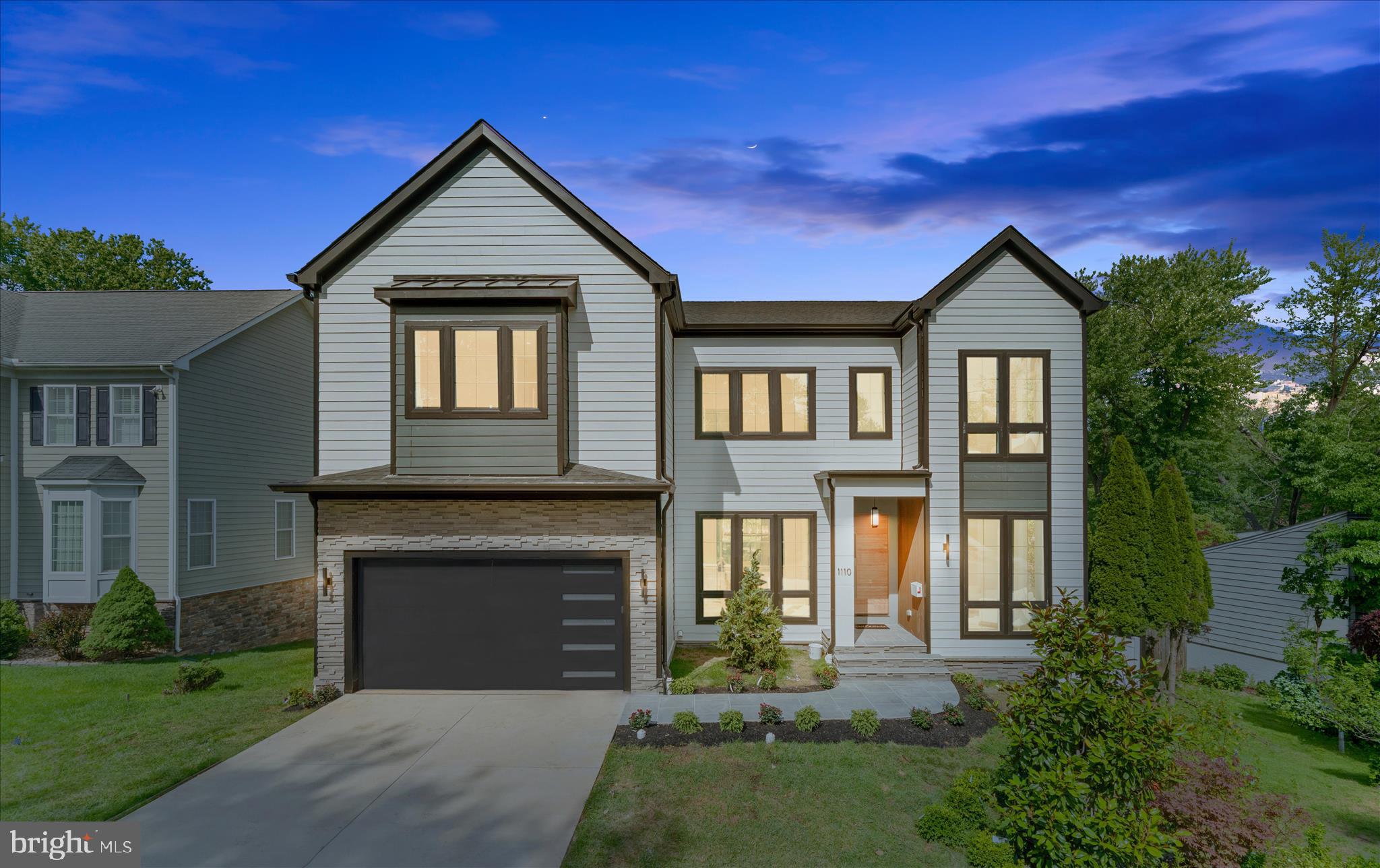 Another exceptional custom residence by Engee Homes, showcasing refined luxury and thoughtful design across approximately 5,500 square feet. This home offers 6 bedrooms, 6 full baths, and 2 half baths in a seamless transitional open-concept layout, wit h all bedrooms featuring private baths. The main level opens with a foyer leading to an office/study and a formal dining room with a butler’s pantry. The family room, centered around a cozy fireplace, opens to a screened porch for a seamless indoor-outdoor flow. The gourmet kitchen is appointed with high-end appliances, custom cabinetry, and a statement island with dual waterfall features, with direct access to an open deck. A secondary bedroom with full bath, powder room, and a mudroom lead to a two-car garage equipped with an EV outlet. The upper level features a primary suite, three additional bedrooms, and a family loft, offering flexibility for both everyday living and entertaining.The walk-out lower level is designed for entertaining and extended living, featuring the sixth bedroom with full bath, a theater room, fitness room, wet bar, additional half bath, and ample storage, with access to the lower outdoor living area.
Engineered hardwood flooring extends throughout all three levels, and the home is elevator-ready. Estimated delivery May 2026.