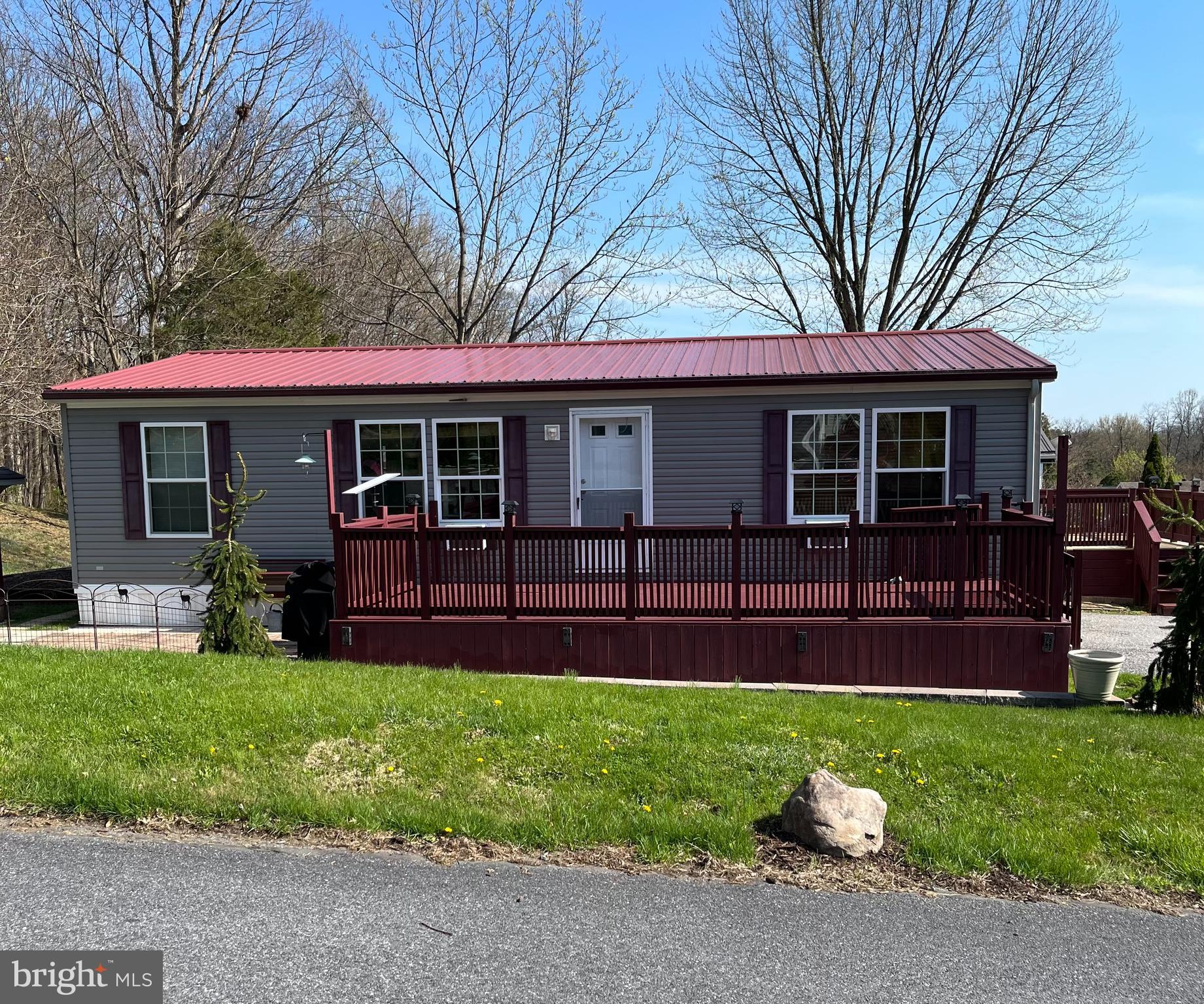 This beautifully maintained, low-maintenance single-level home has been thoughtfully upgraded and is truly better than new. The interior features a high-end kitchen complete with granite countertops and top-of-the-line appliances, along with durable vinyl plank flooring that extends throughout most of the home.

Recent improvements include a new roof and gutter system, along with numerous quality upgrades that add both style and functionality throughout. The spacious primary bedroom offers double closets and a private full bathroom for added comfort.

The laundry room is equipped with commercial-grade Maytag washer and dryer units, providing convenience and reliability.

Outside, the property boasts a well-manicured, easy-to-maintain lot with a raised garden bed—perfect for gardening enthusiasts. Enjoy outdoor living with generous front and side decks, plus a patio ideal for relaxing or entertaining. A storage shed adds valuable extra space for tools and equipment.