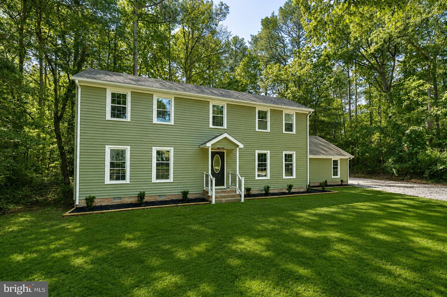 Beautifully renovated 3 bedroom, 2 bathroom Colonial-style home located in the highly sought-after Wildwood Trail neighborhood — a peaceful wooded no-through community. Situated on 1.19 acres, this 2,112 sq ft home offers plenty of space both inside and out.

The main level features a large open living room and kitchen area with new flooring throughout, fresh paint, and brand-new appliances. Off the connected kitchen & dining room, a large sliding glass door leads out to the new back deck, perfect for entertaining or enjoying the private backyard setting. The first floor a includes a spacious downstairs bedroom, full bathroom, and an additional flex room ideal for a home office, guest room, or extra living space.

Upstairs offers two generously sized bedrooms and another full bathroom. The attached 1-car garage includes a large finished bonus room, perfect for a home office, workout area, hobby room, or workshop.

A move-in ready property offering space, flexibility, and a desirable location!