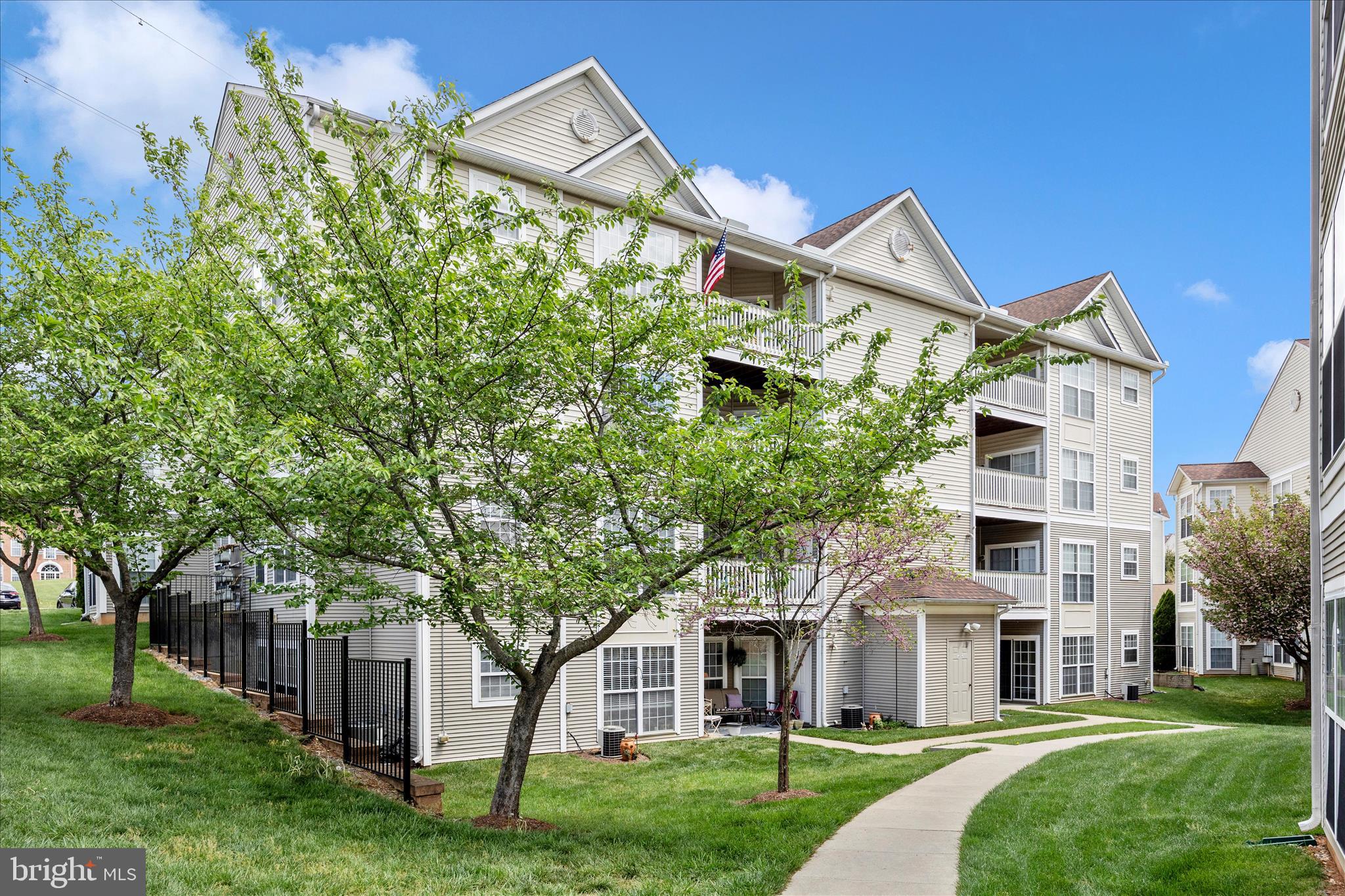 Discover a hidden gem in Whittier! This beautifully remodeled first-level condo features a private entrance, spacious two-bedroom, two-bath floor plan, and a secluded setting that feels worlds away from typical condominium living. Enjoy the ease of maintenance-free ownership while experiencing the comfort, privacy, and independence more commonly associated with a townhome, all combined with an abundance of Whittier amenities. Settle into this spacious home featuring a private rear entrance, assigned parking, abundant natural light, a private patio, hardwood flooring, fresh paint, and a unique floor plan designed to complement a variety of lifestyles. Remodeled in 2019, the thoughtfully designed layout includes a bright and inviting primary suite with a walk-in closet and private bath, a versatile den, office, or breakfast nook off the kitchen with built-in cabinetry, a separate dining area, a generously sized second bedroom, and a second full bath. A dedicated laundry closet and additional storage enhance the home's everyday functionality.
Enjoy all that Whittier has to offer, including multiple pools, playgrounds, walking and biking trails, a pavilion, fishing pond, basketball courts, and tennis courts, along with nearby shopping centers for everyday convenience. Just minutes away, Historic Downtown Frederick offers more than 200 specialty shops, restaurants, entertainment venues, and art galleries, creating one of Maryland's most vibrant destinations. Convenient access to Routes 15, 70, 340, and 270 makes commuting throughout the region simple and efficient.